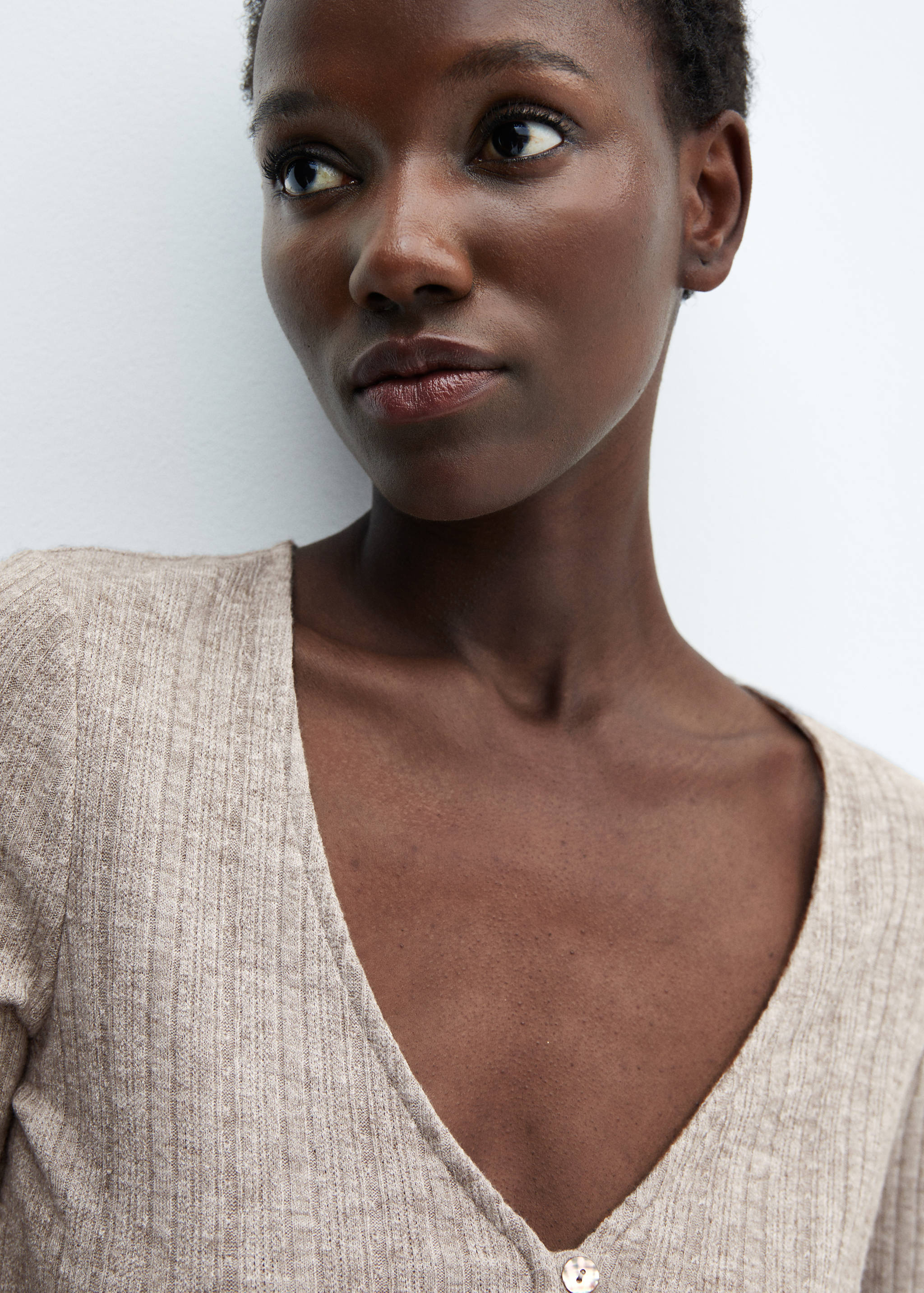 Knitted t-shirt with button - Details of the article 1