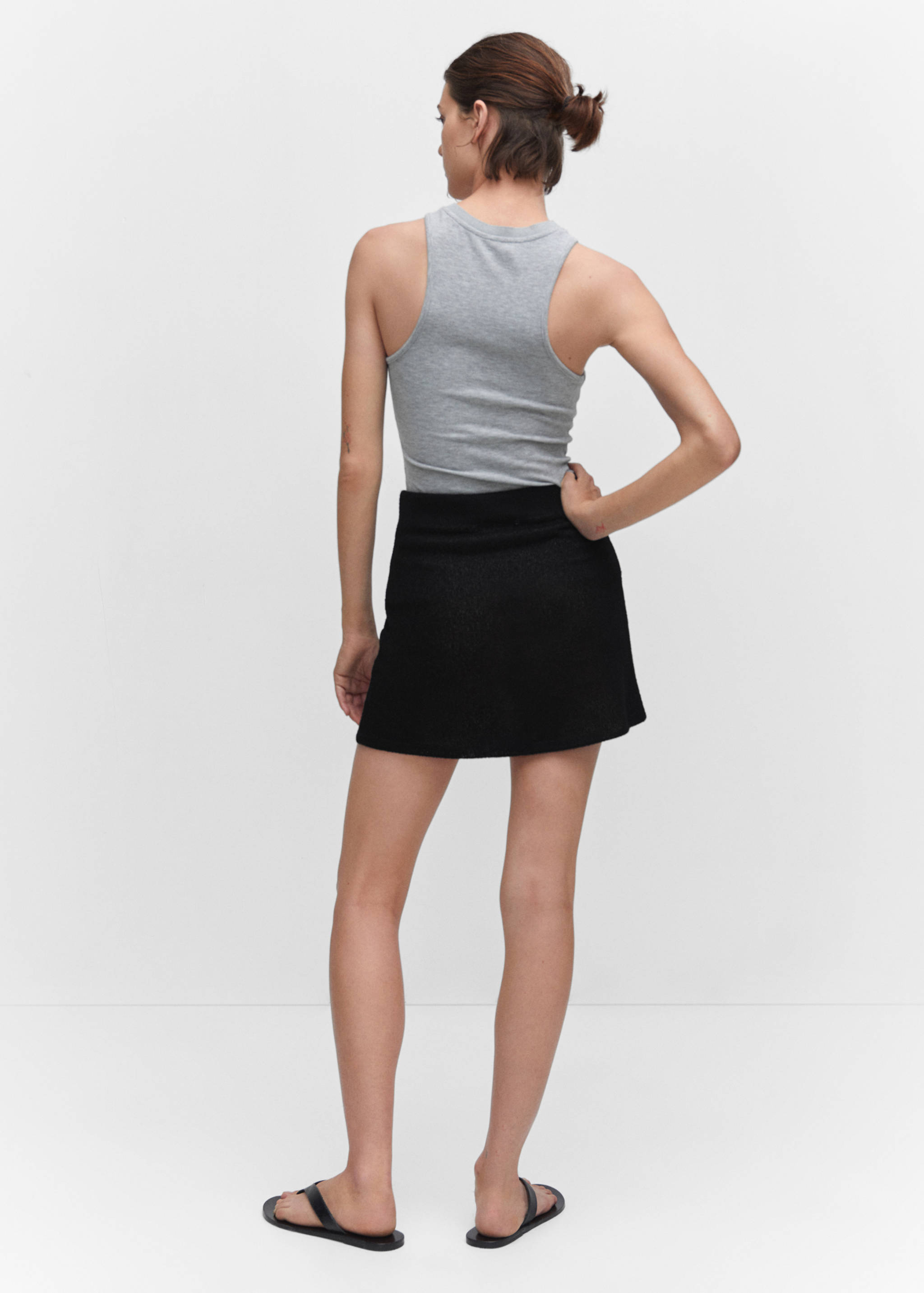 Semi-transparent knitted mini-skirt - Reverse of the article