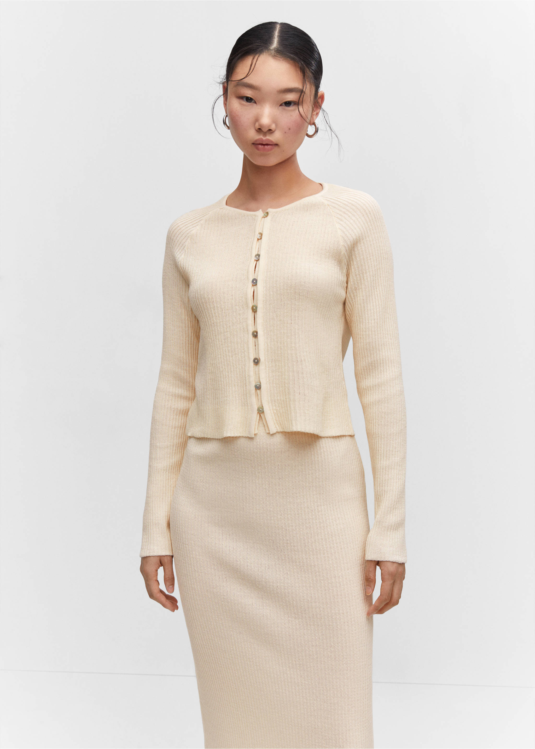 Long knitted skirt - Details of the article 1, Ecru. Ref: 57083816-00.