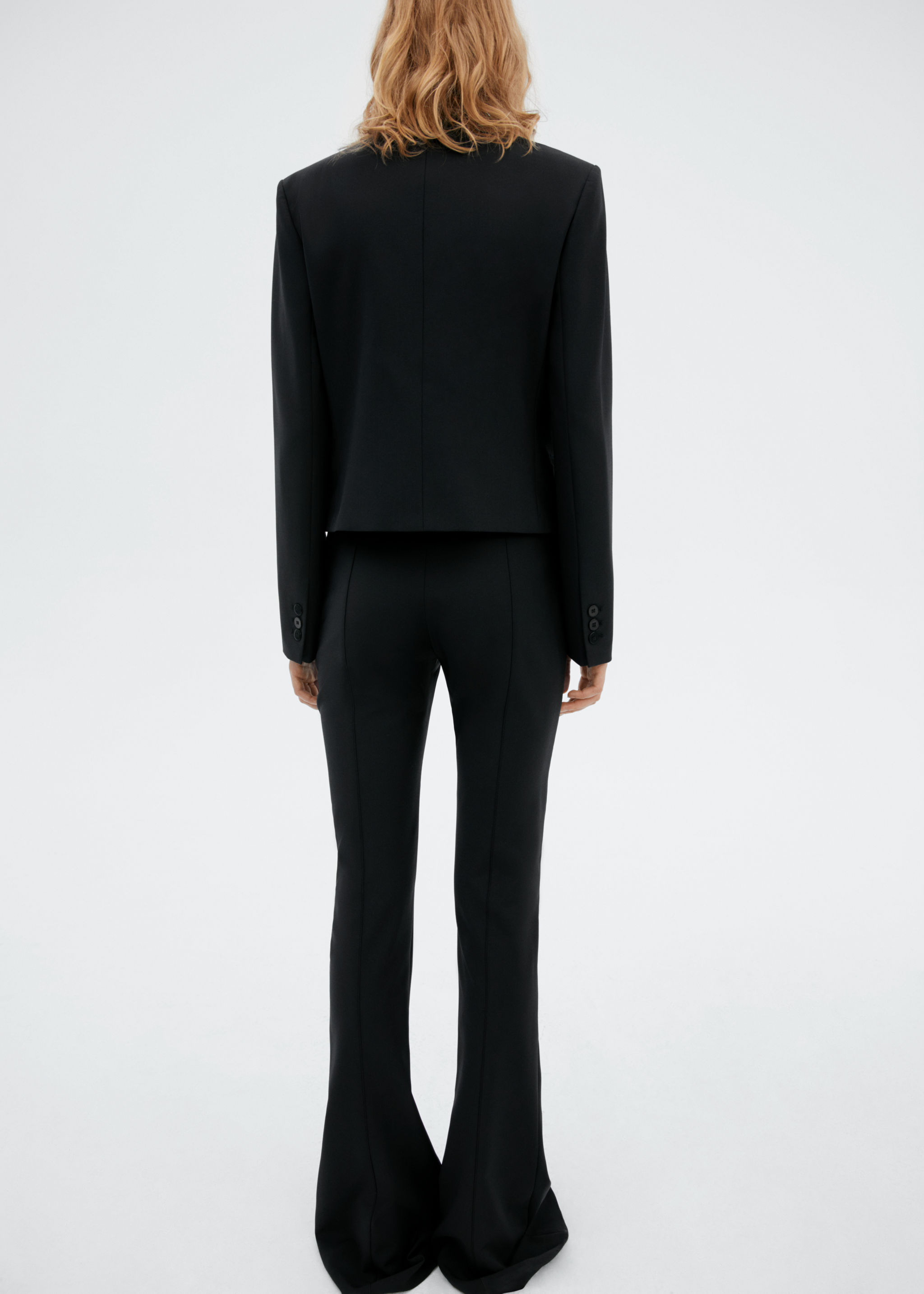 Pantalons llana acampanats - Revers de l'article