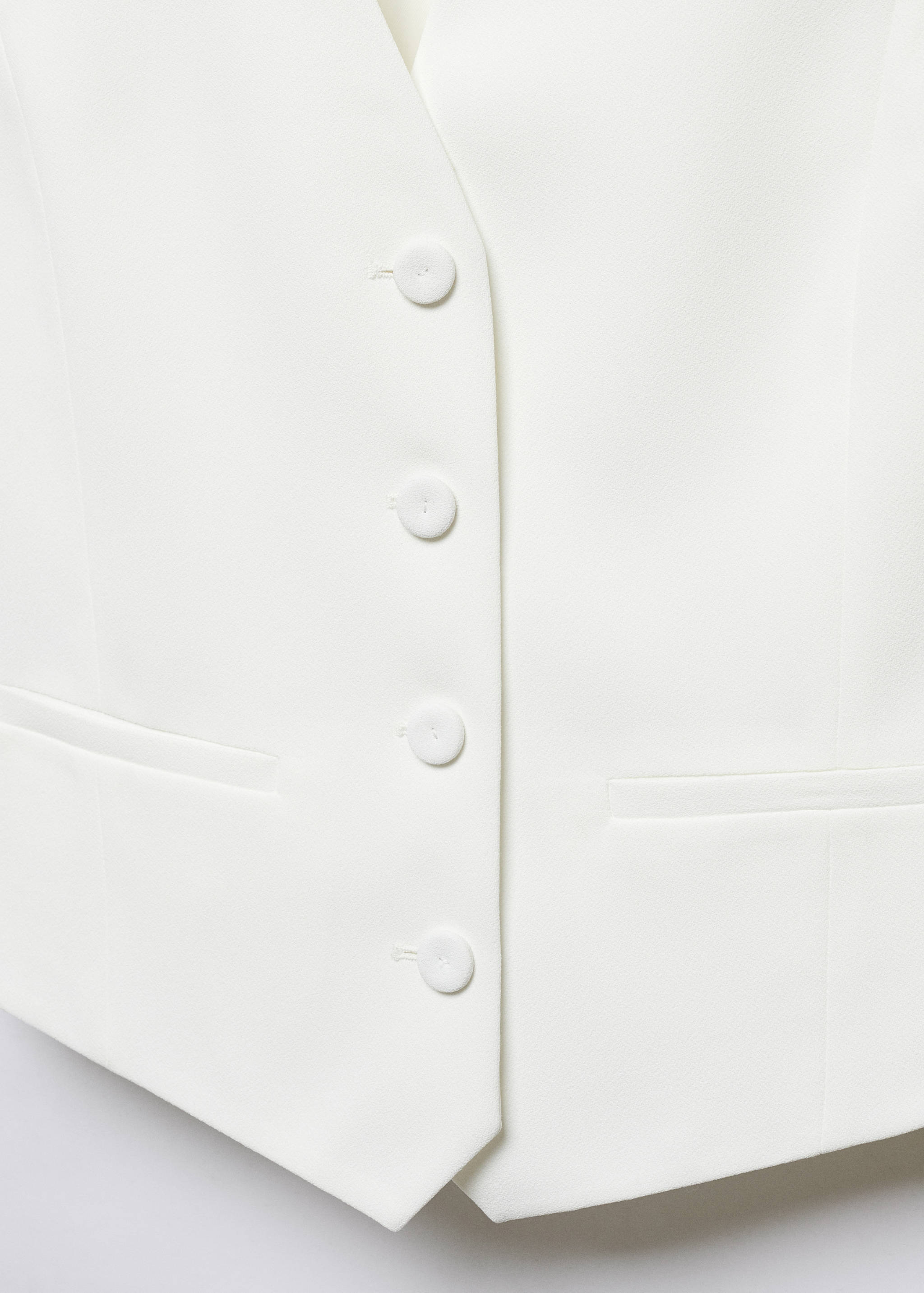 Gilet met knopen - Detail van het artikel 8