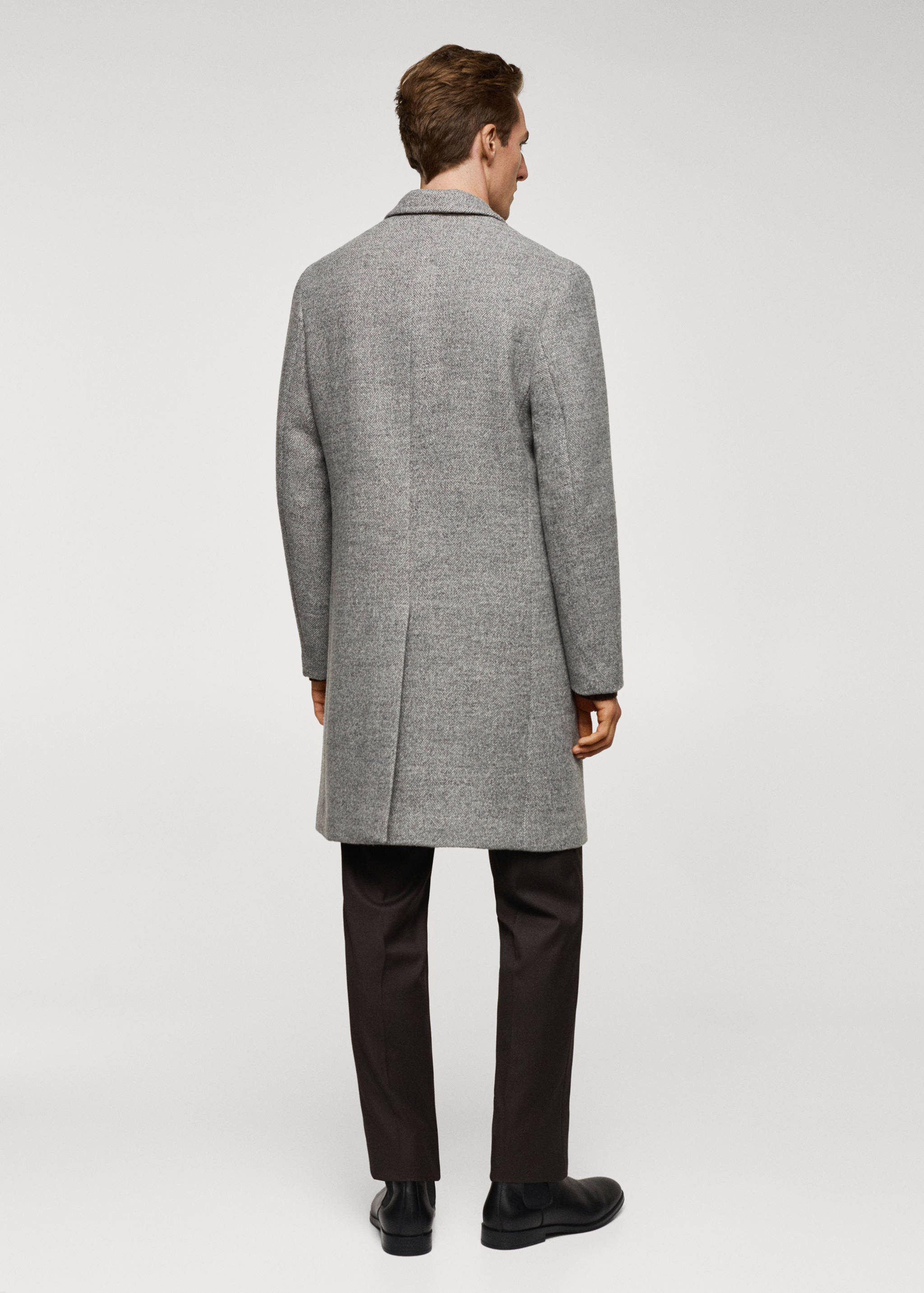 Wełniany płaszcz w jodełkę - Tylna strona artykułu