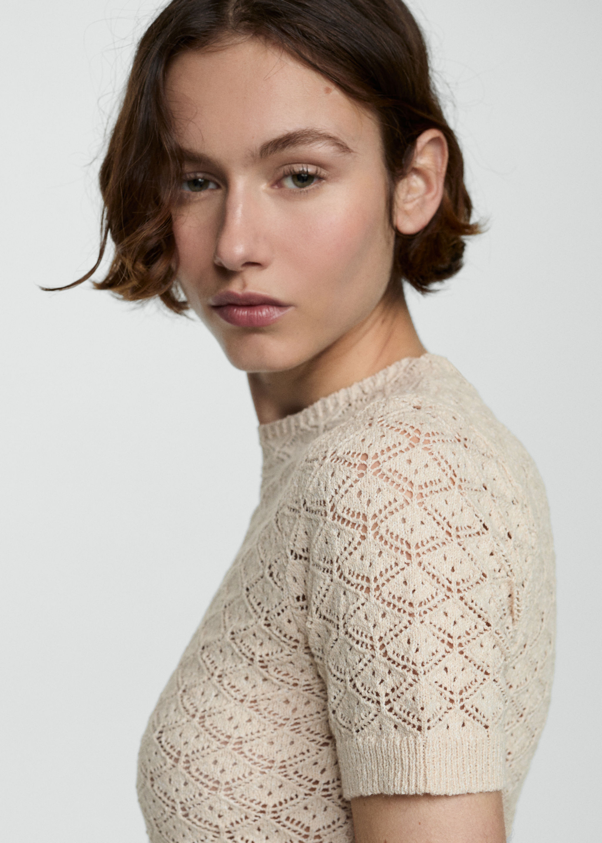 Kurzämliger Pullover mit Lochmuster - Detail des Artikels 1