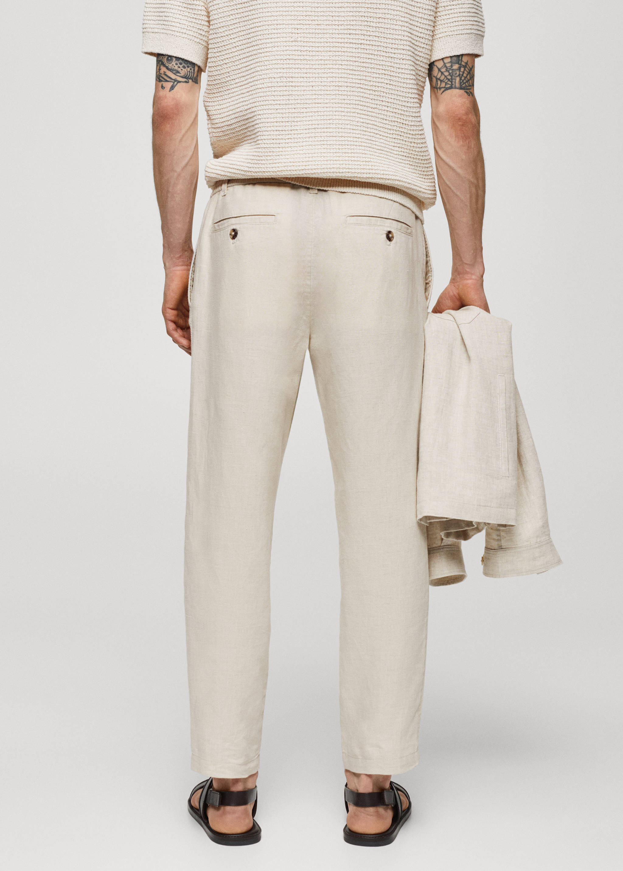 Slim-fit trousers with drawstring - Reverse of the article