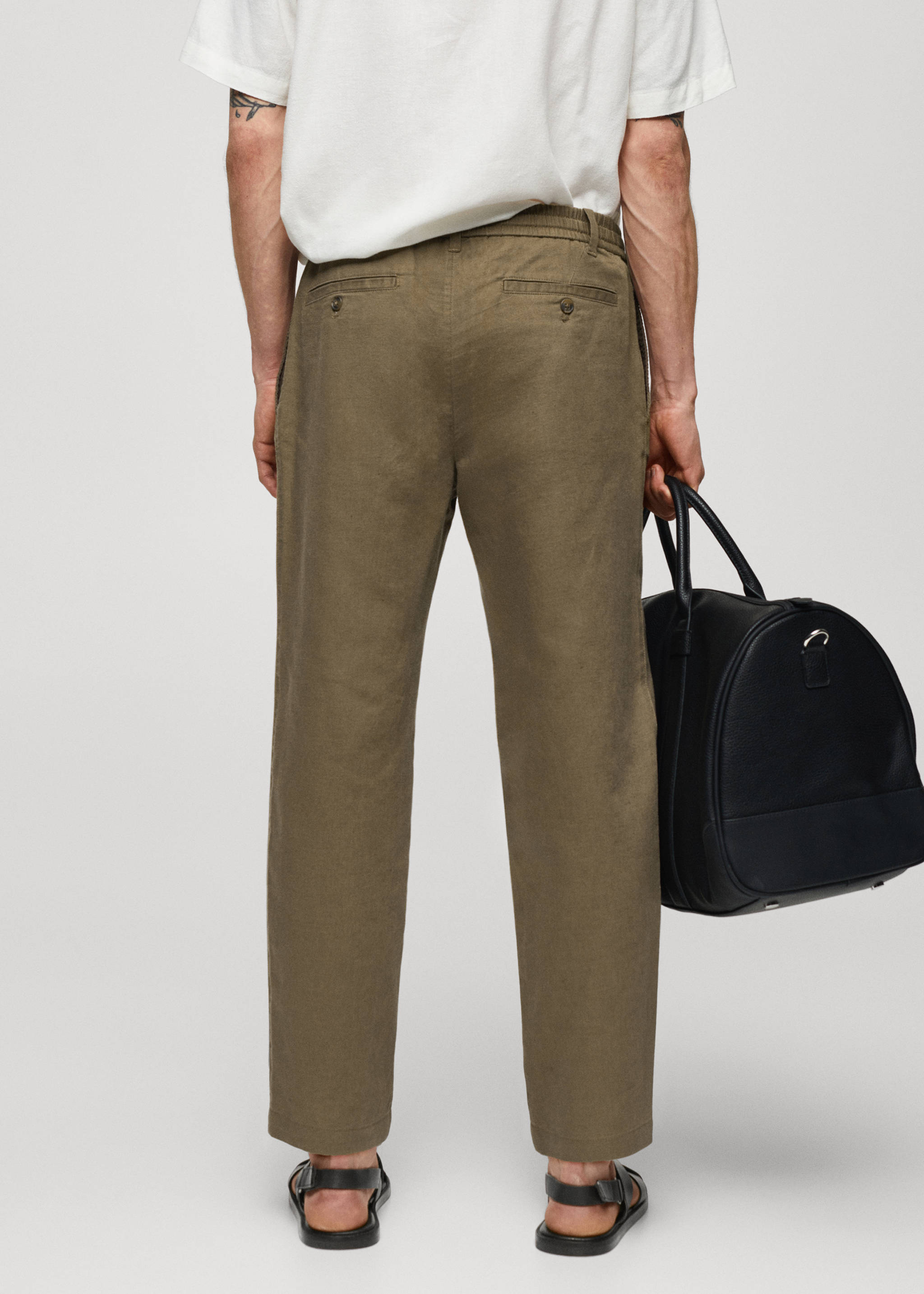 Slim-fit trousers with drawstring - Reverse of the article