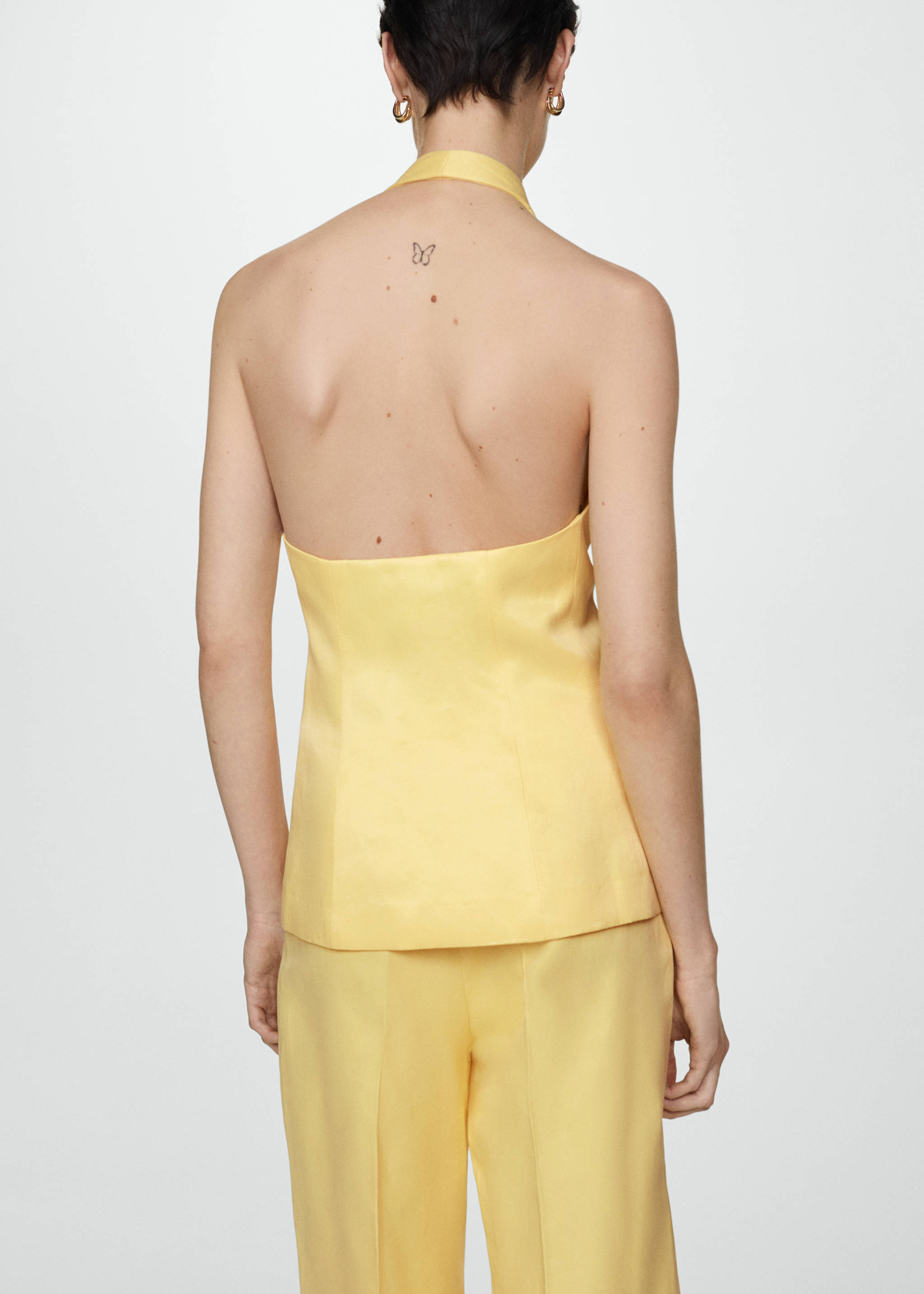 Halter-neck vest with buttons - Reverse of the article