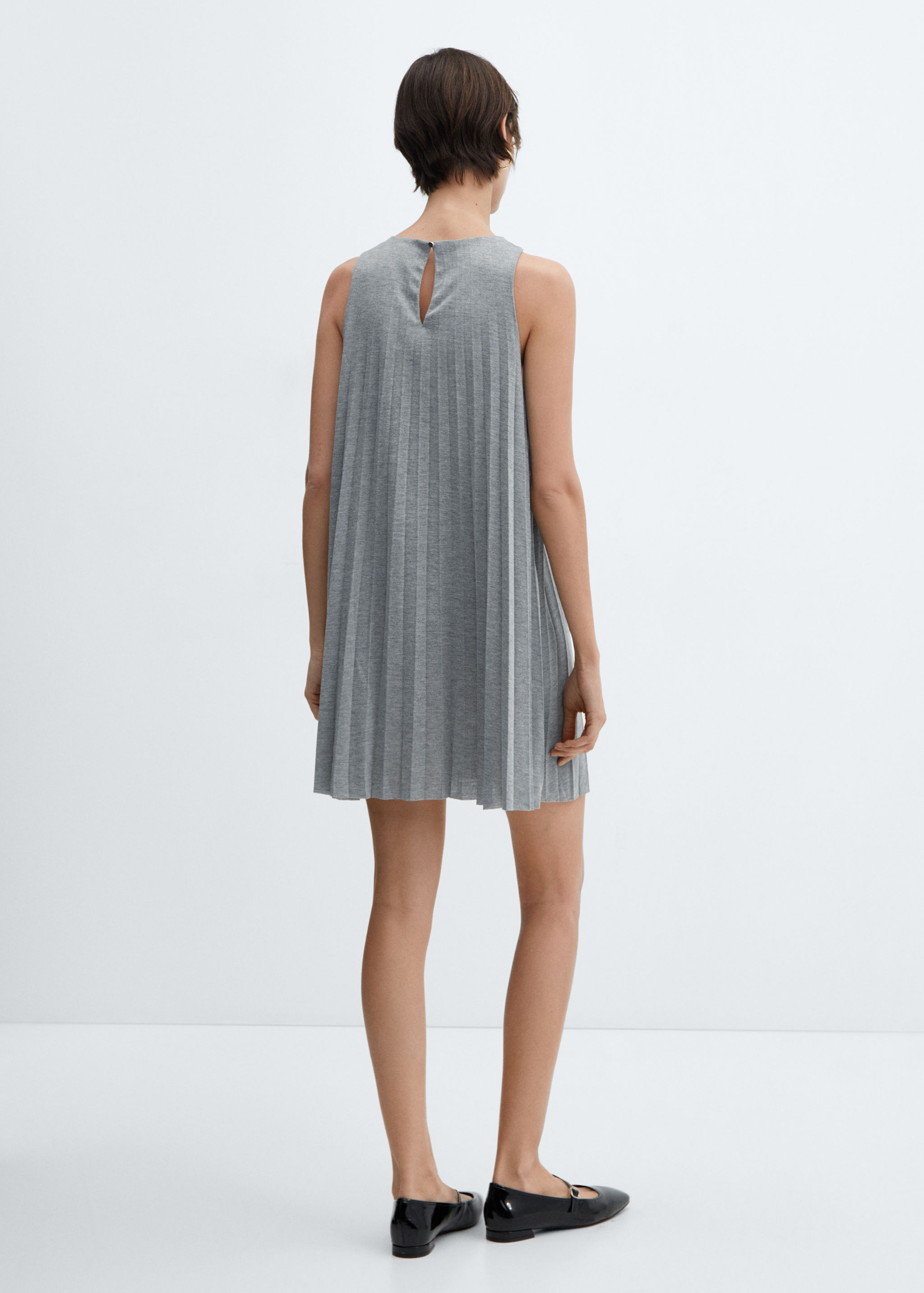 Vestit curt prisat - Revers de l'article