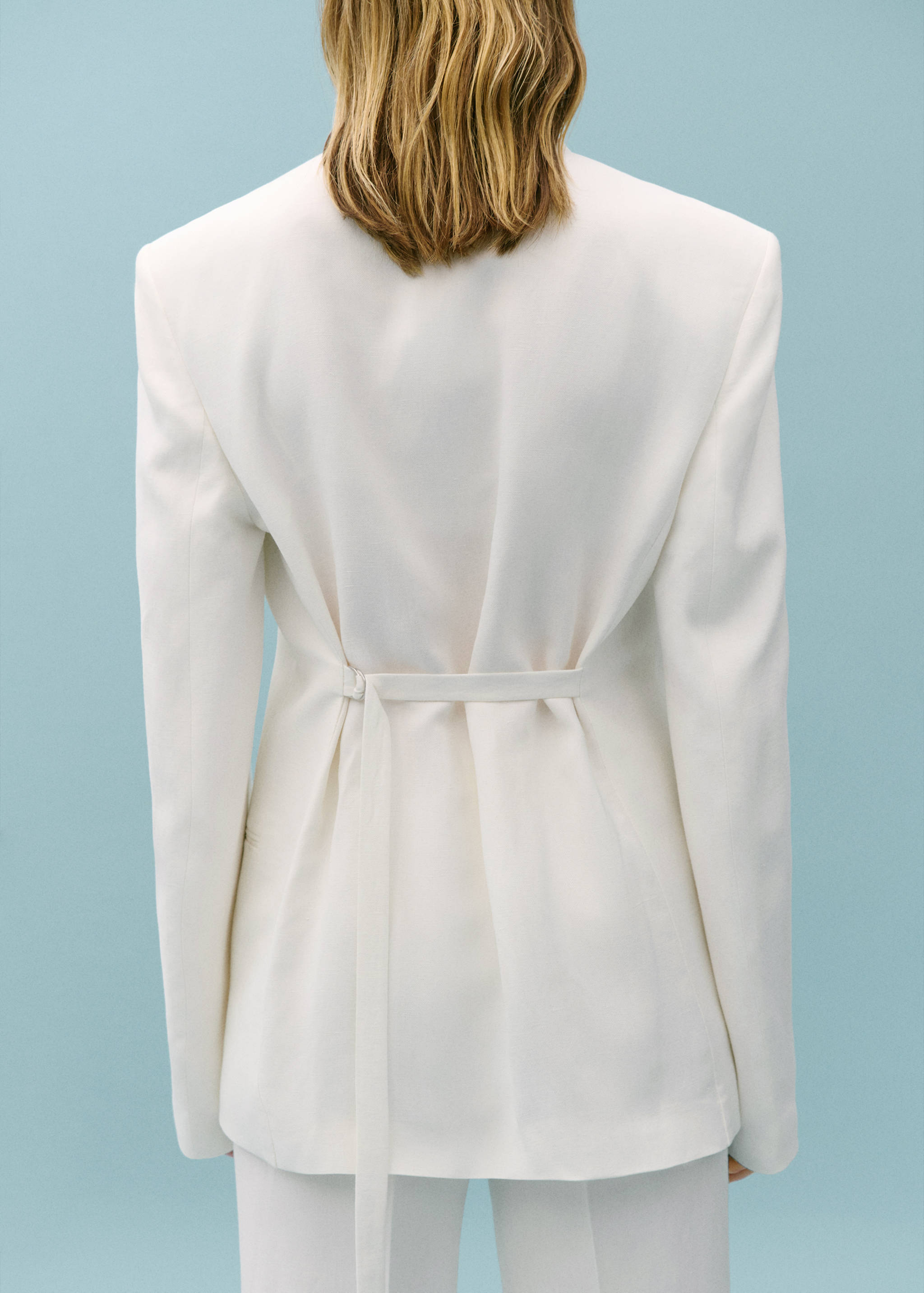 Suit jacket with adjustable back strap - Reverse of the article