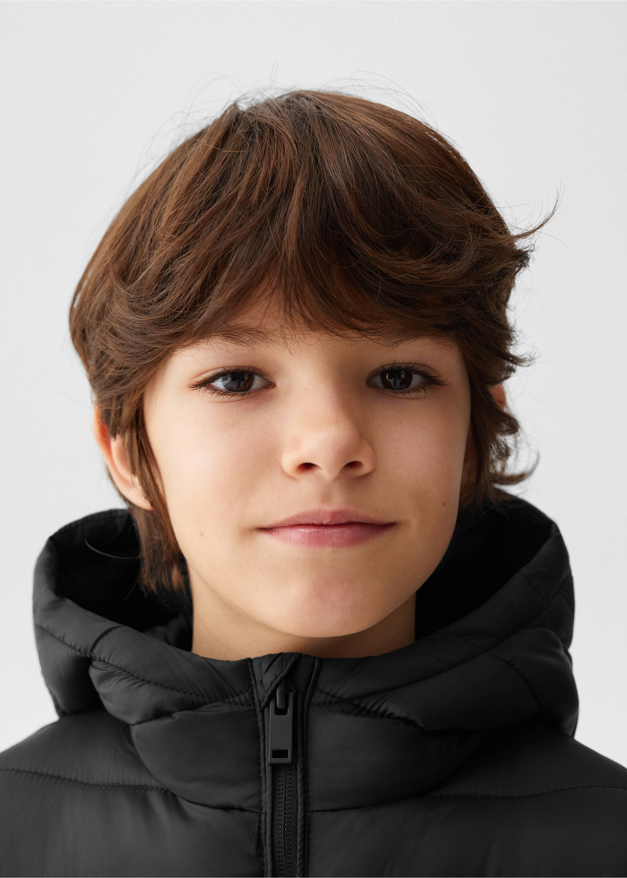 Quilted gilet with hood - Details of the article 1, Black. Ref: 67051505-00.