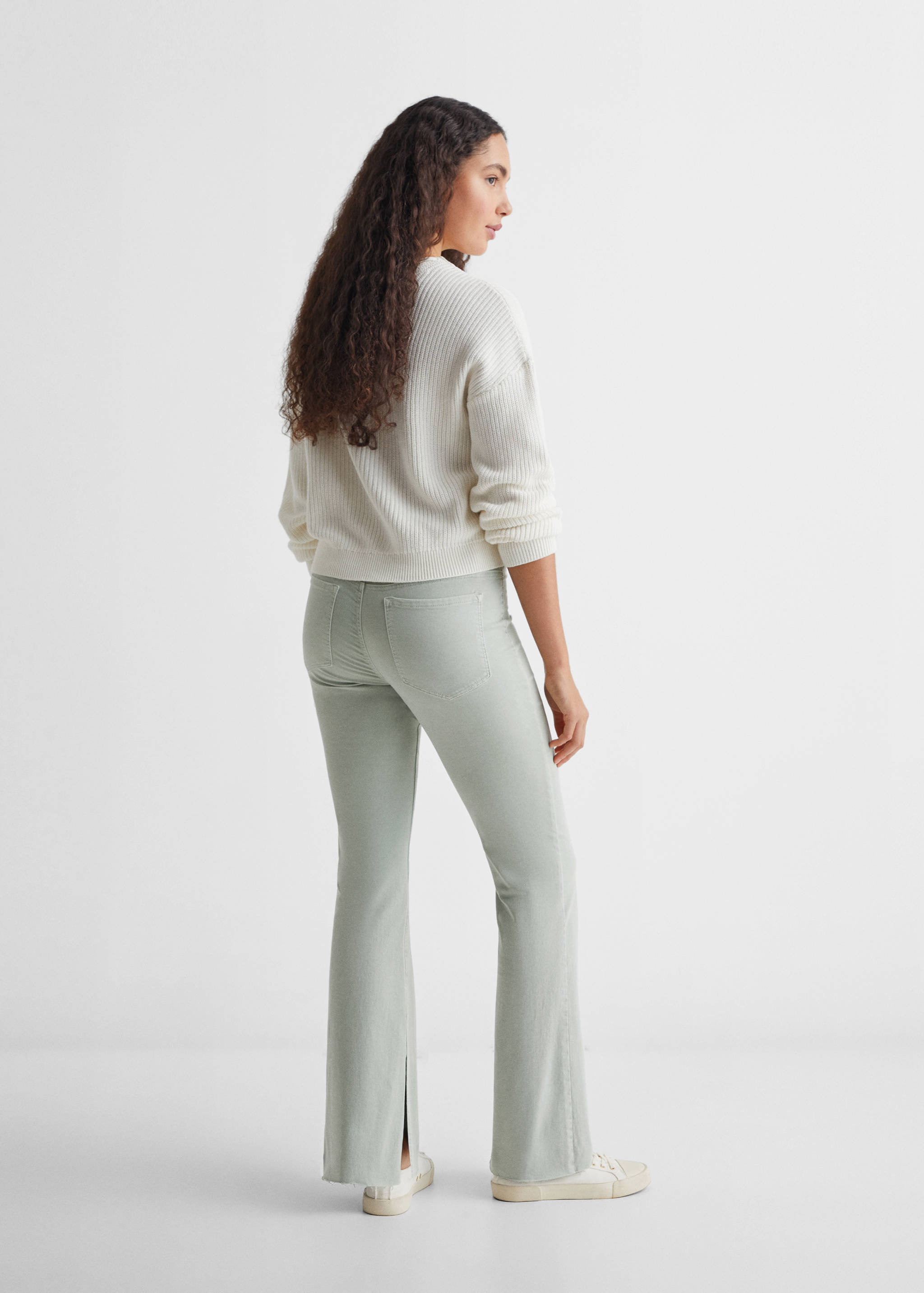 Flared jeans with opening - Reverse of the article
