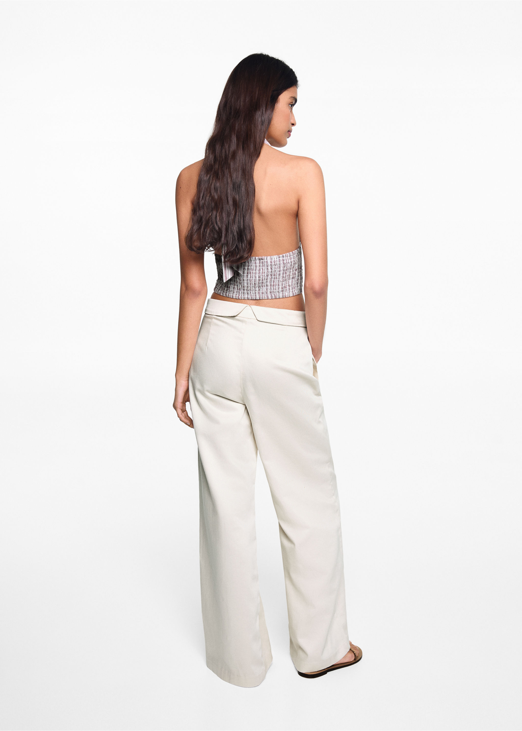Turn-up waist trousers - Reverse of the article