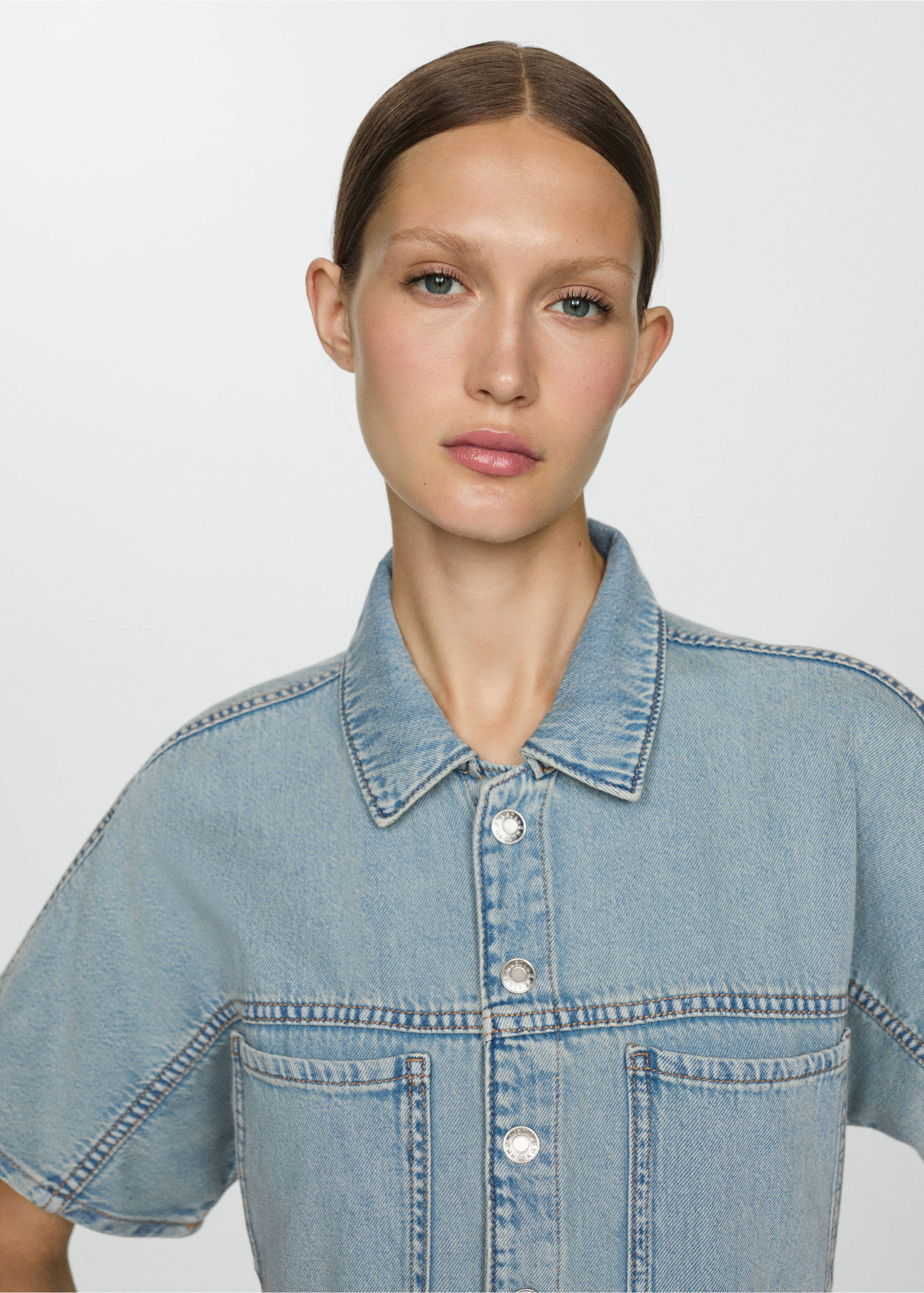 Denim jumpsuit with multi-position buttons - Details of the article 1, Light Blue. Ref: 67057131-00.