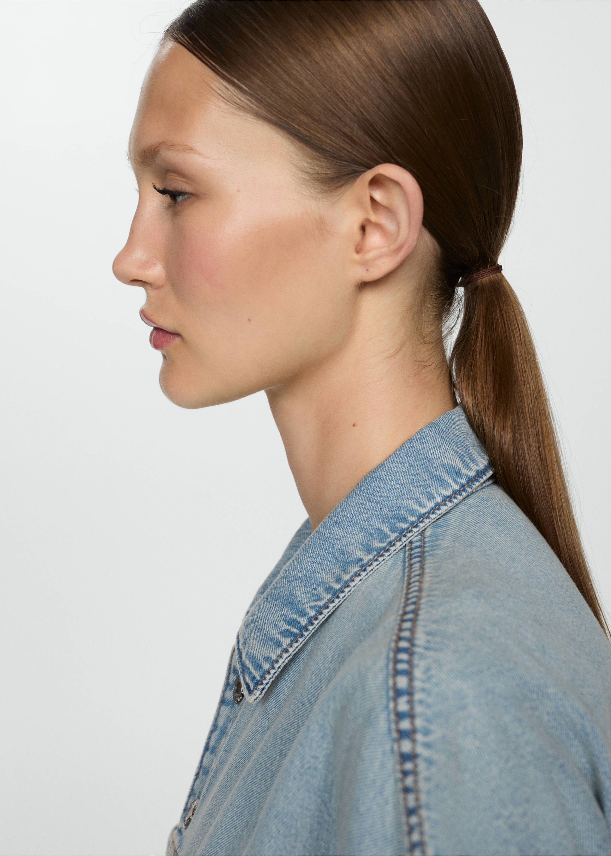 Denim jumpsuit with multi-position buttons - Details of the article 2, Light Blue. Ref: 67057131-00.