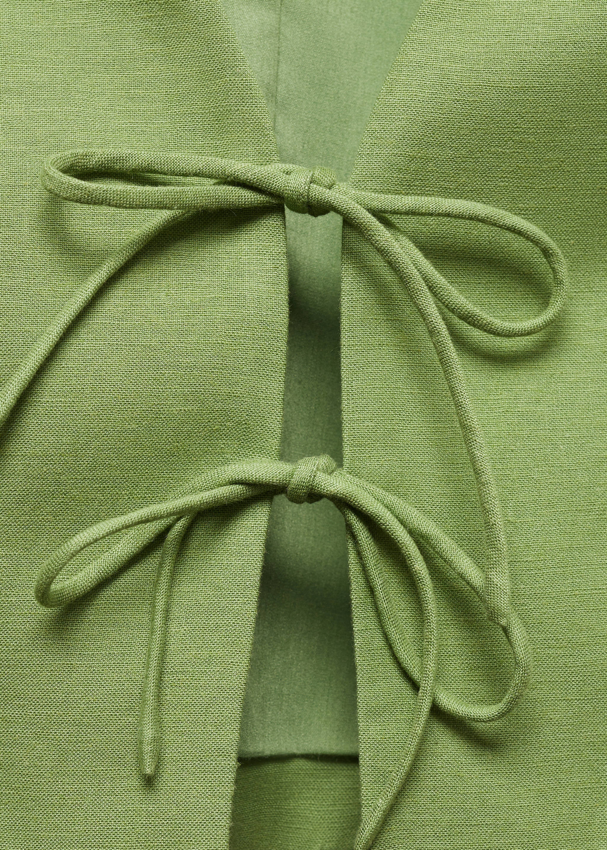 Väst med knytband - Detaljer om artikeln 8