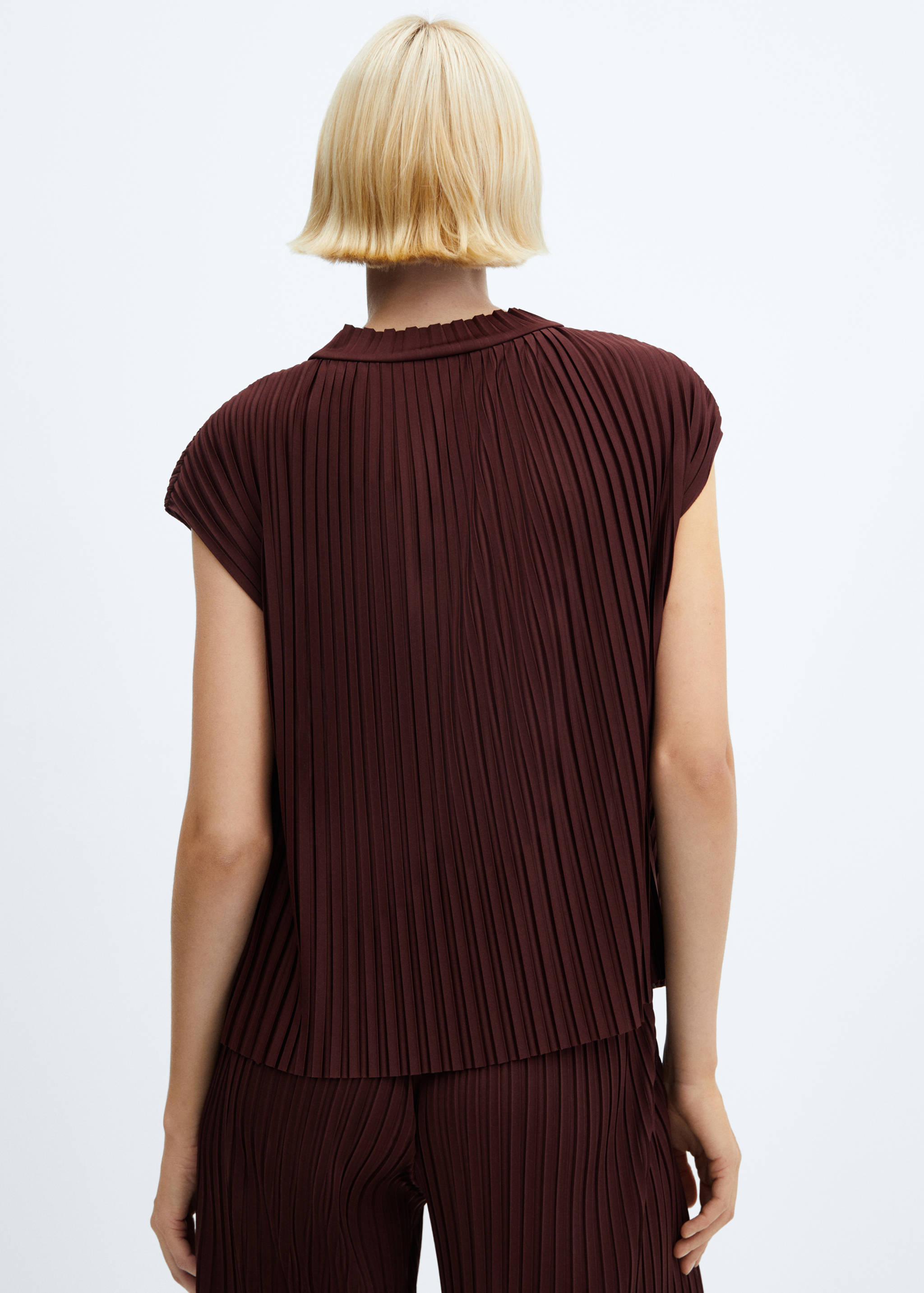 Rövid ujjú, pliszírozott felső - A cikk hátulja