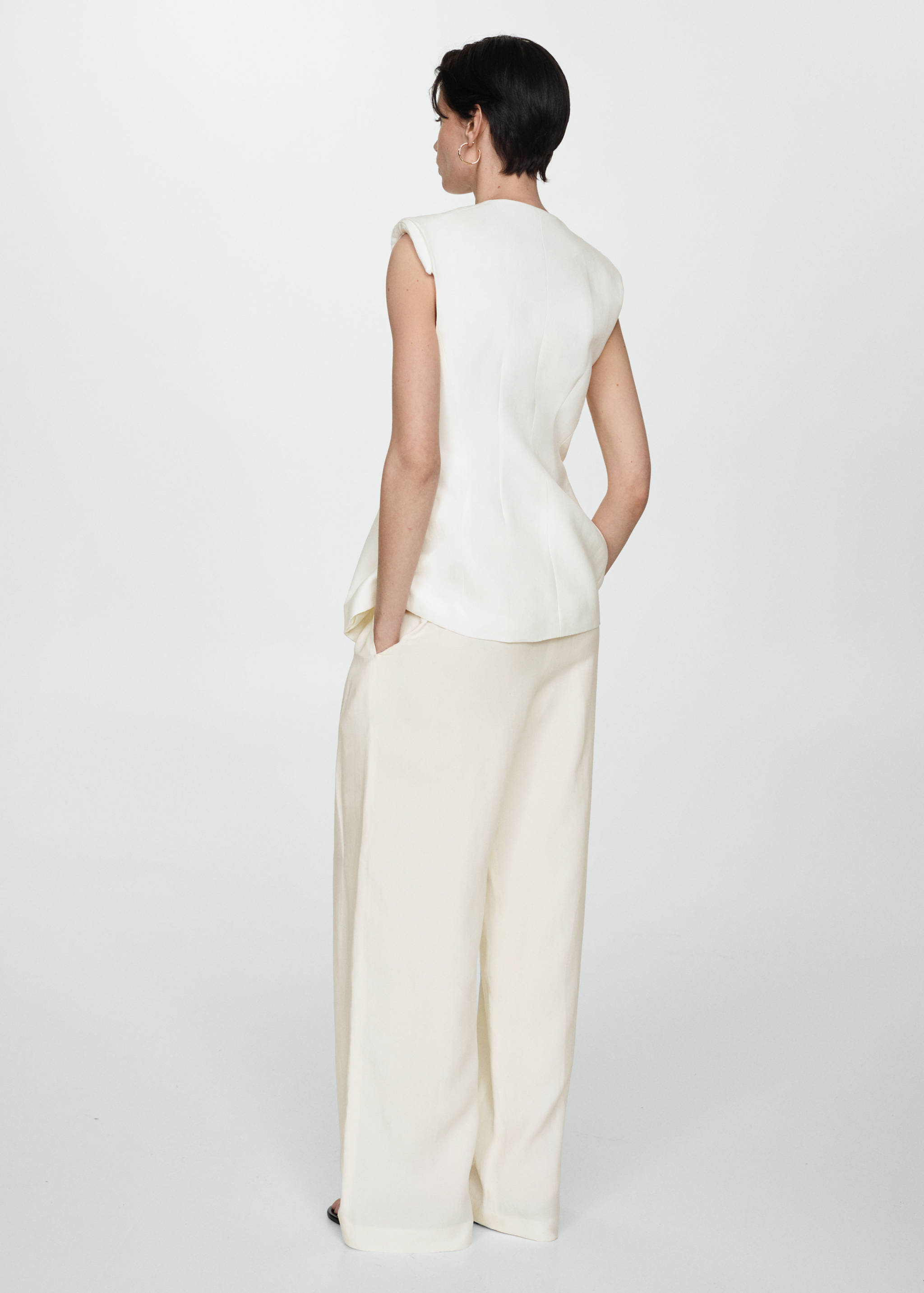 Long vest with buttons - Reverse of the article