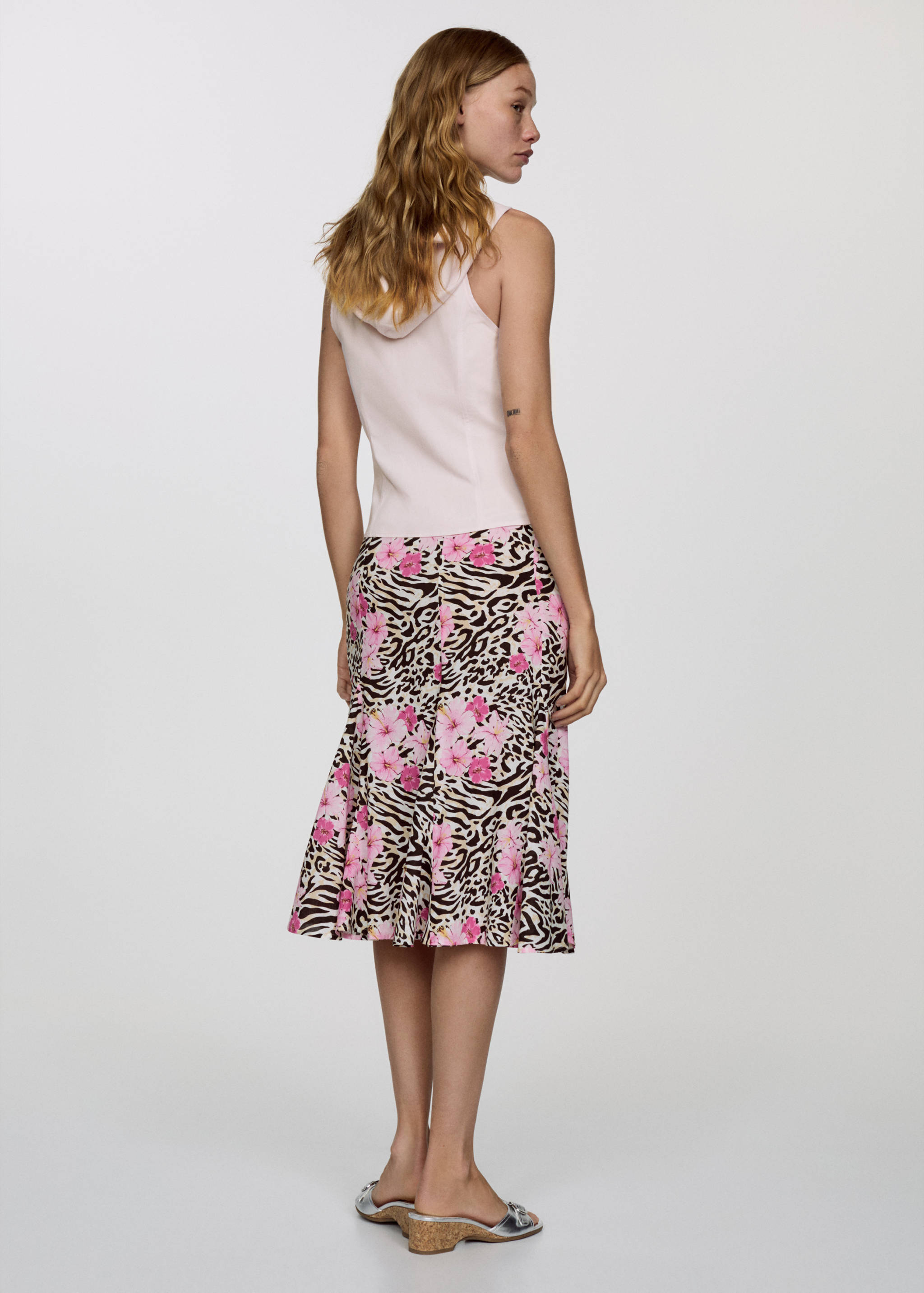 Saia pelo joelho de leopardo - Verso do artigo