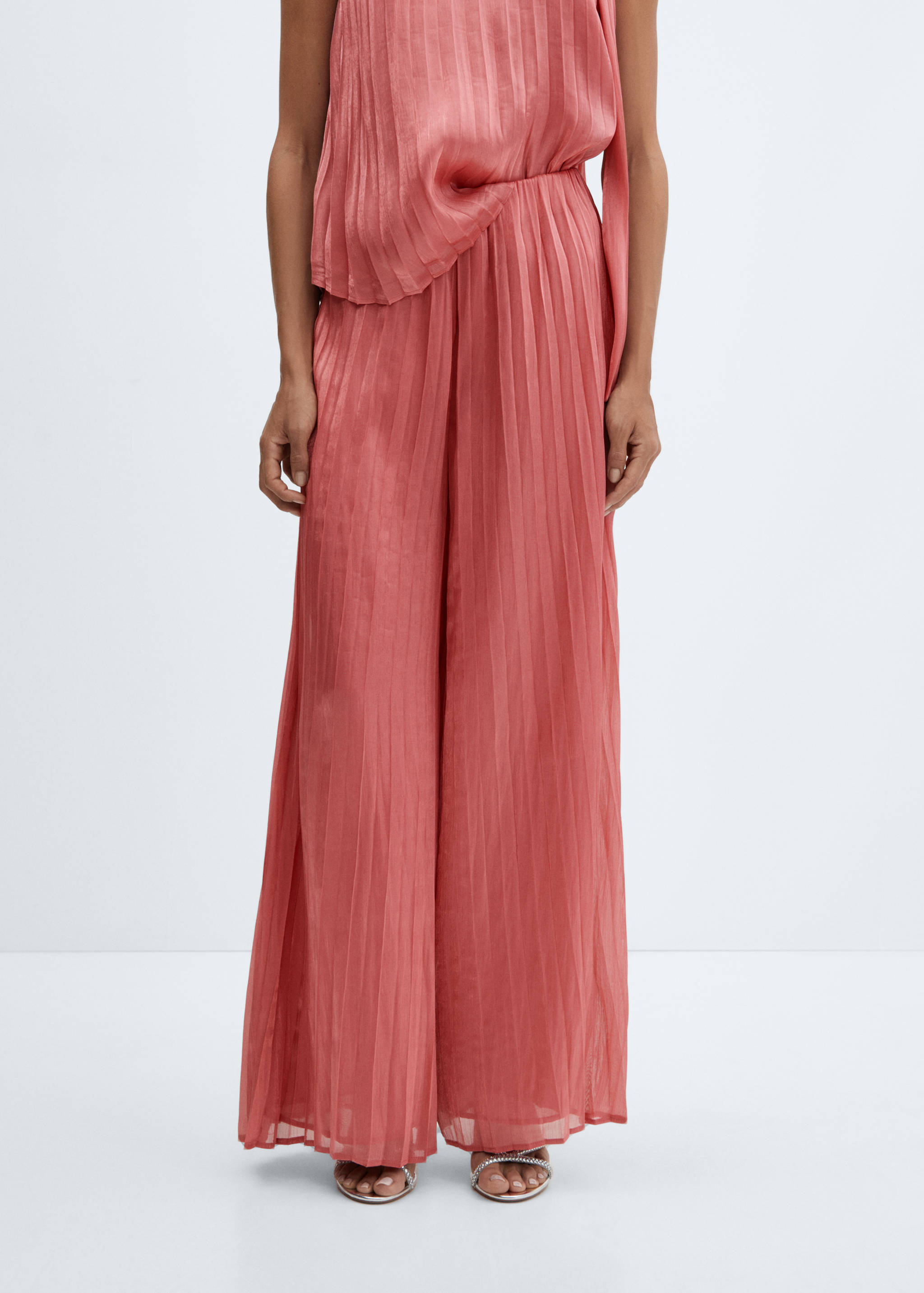 Vida plisserade byxor - Bild av mittparti