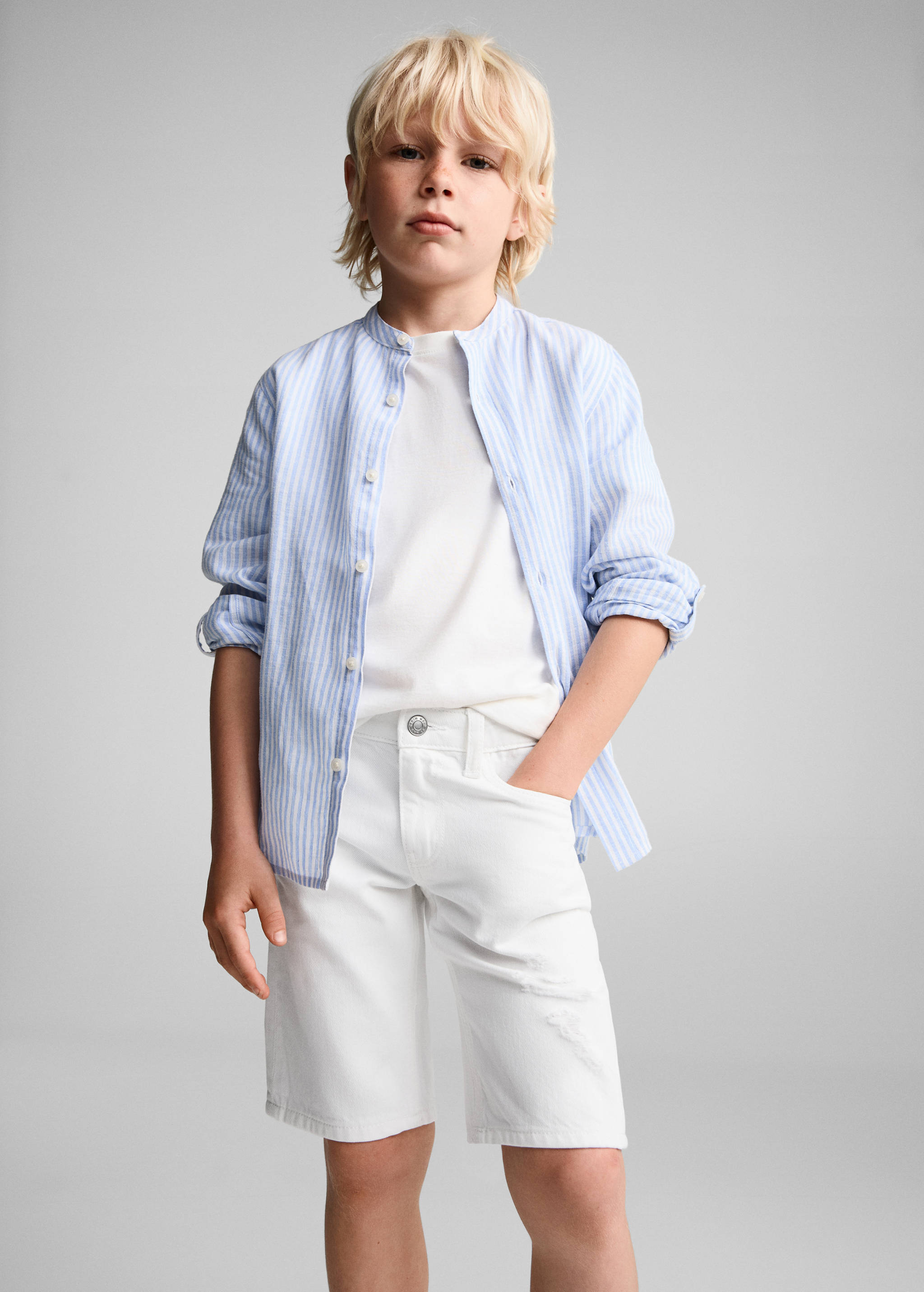 Jeansbermudas dekorativa revor - Bild av mittparti