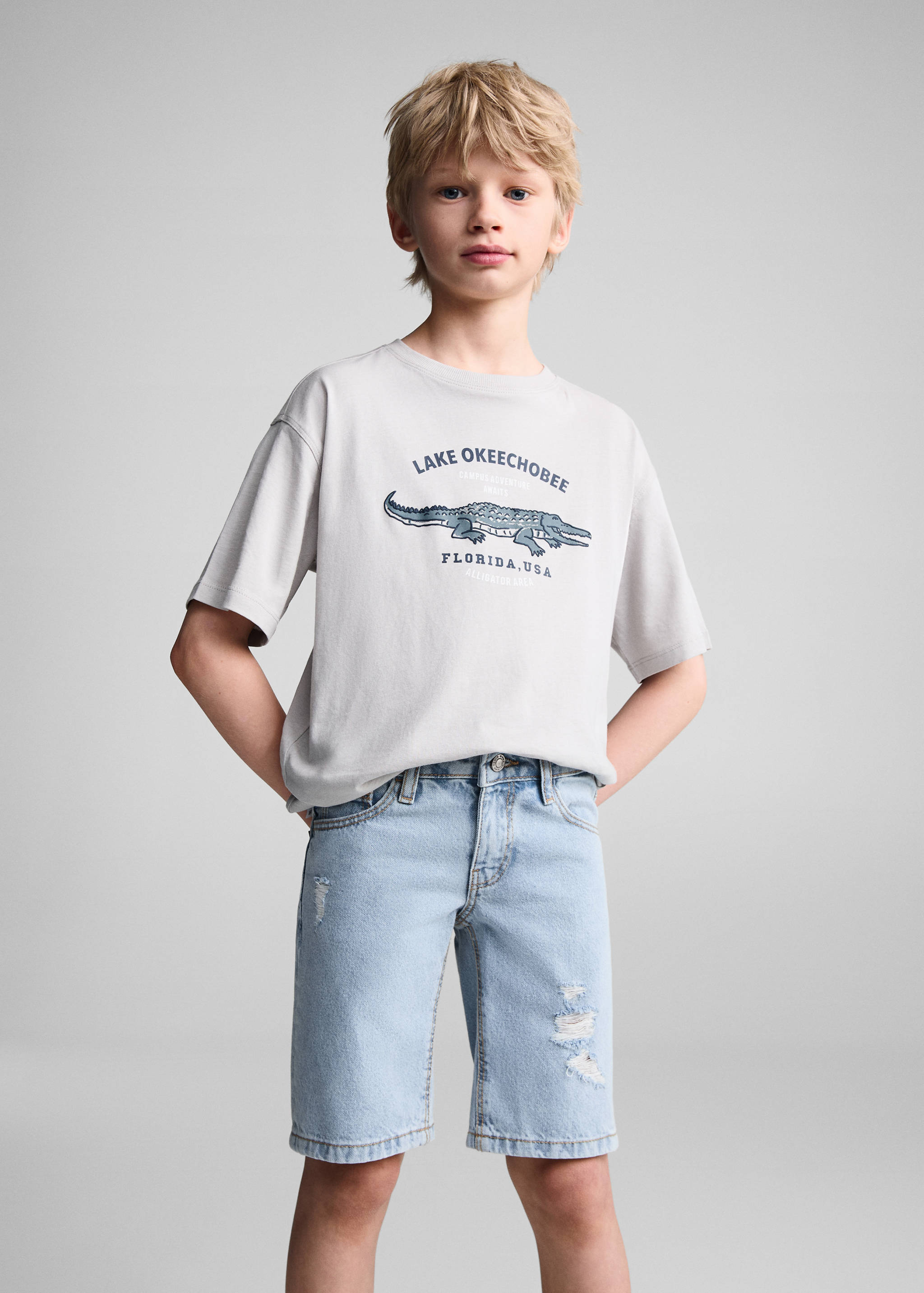 Jeansbermudas dekorativa revor - Bild av mittparti