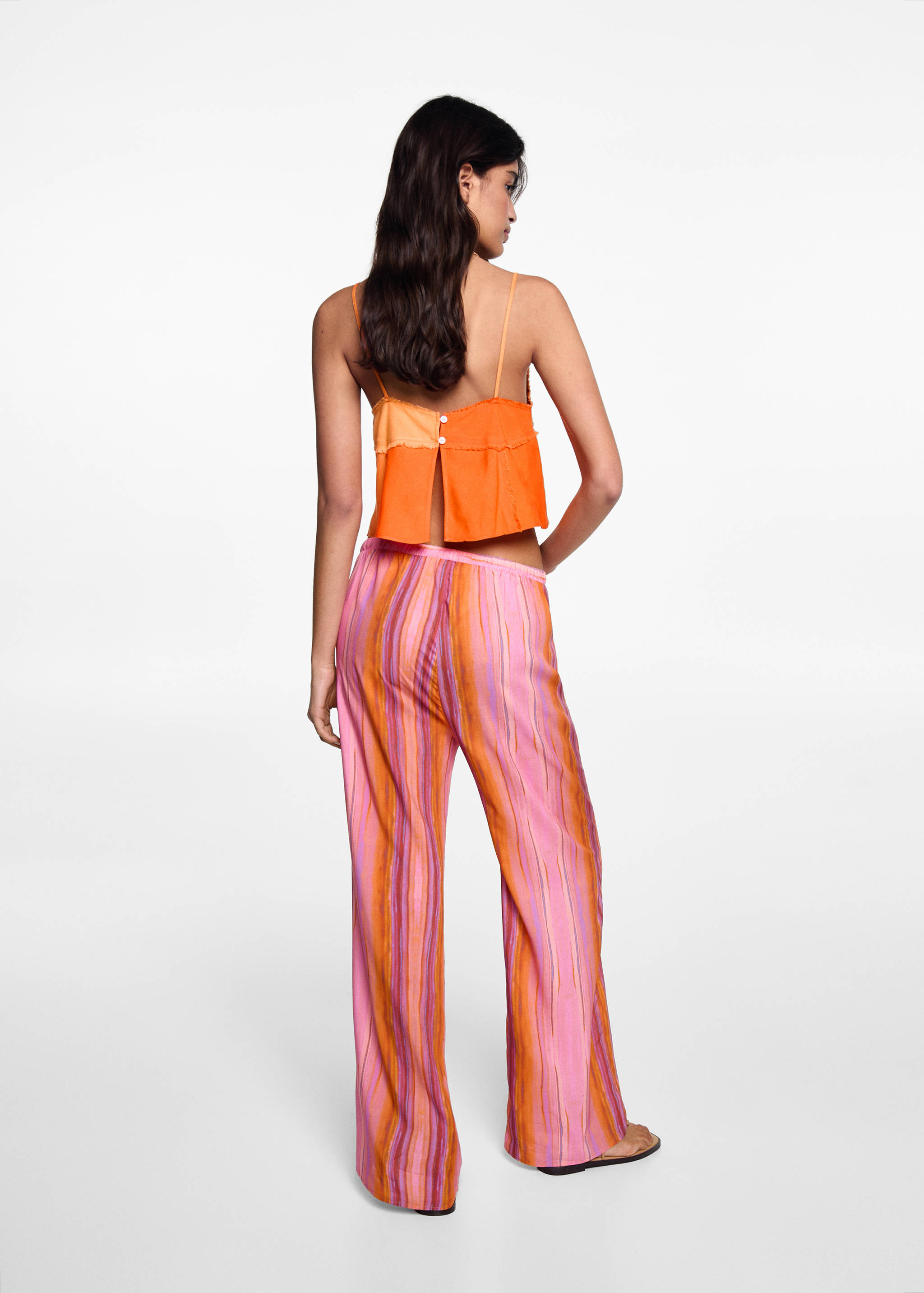 Multi-coloured striped trousers - Reverse of the article