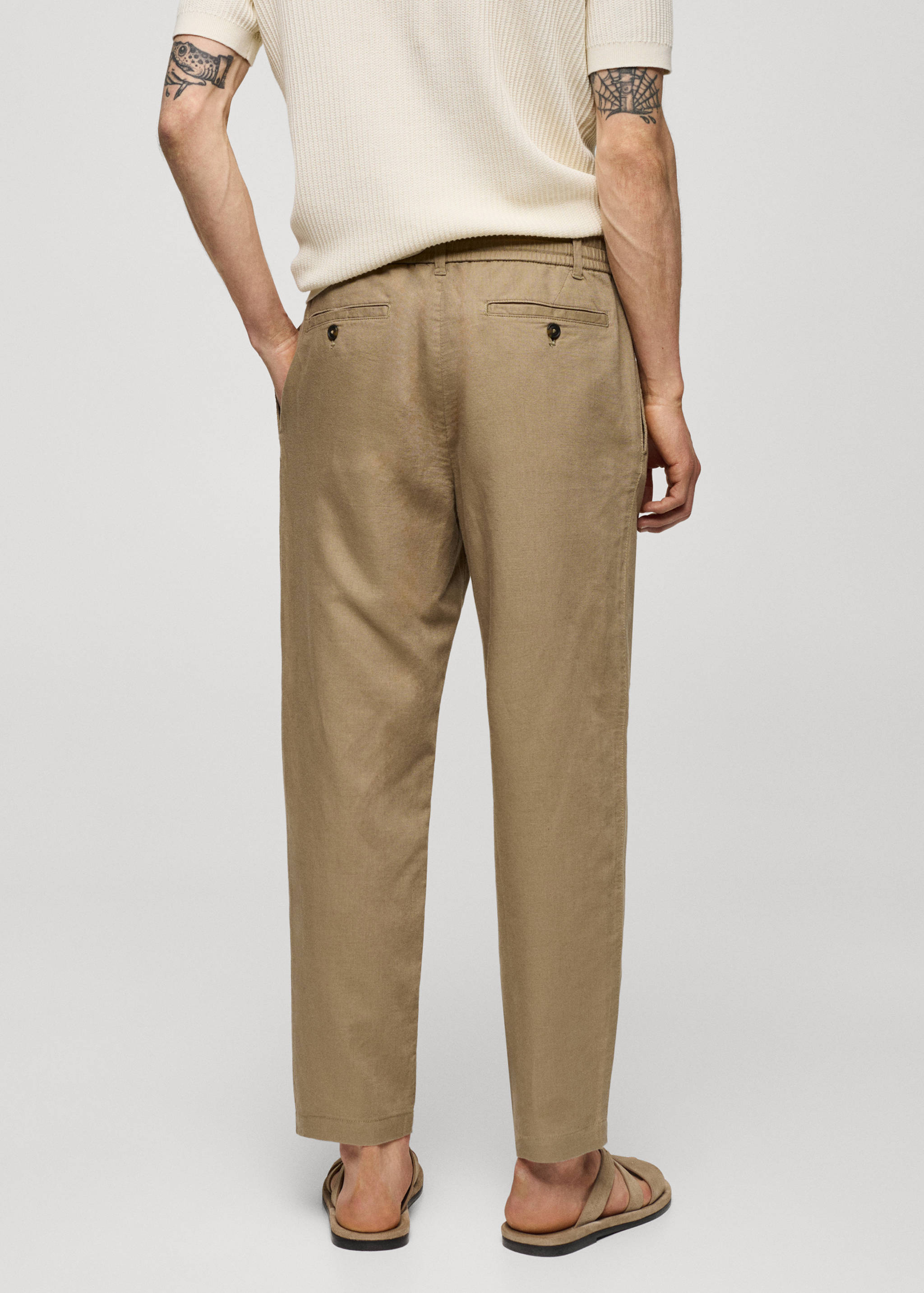 Slim-fit trousers with drawstring - Reverse of the article