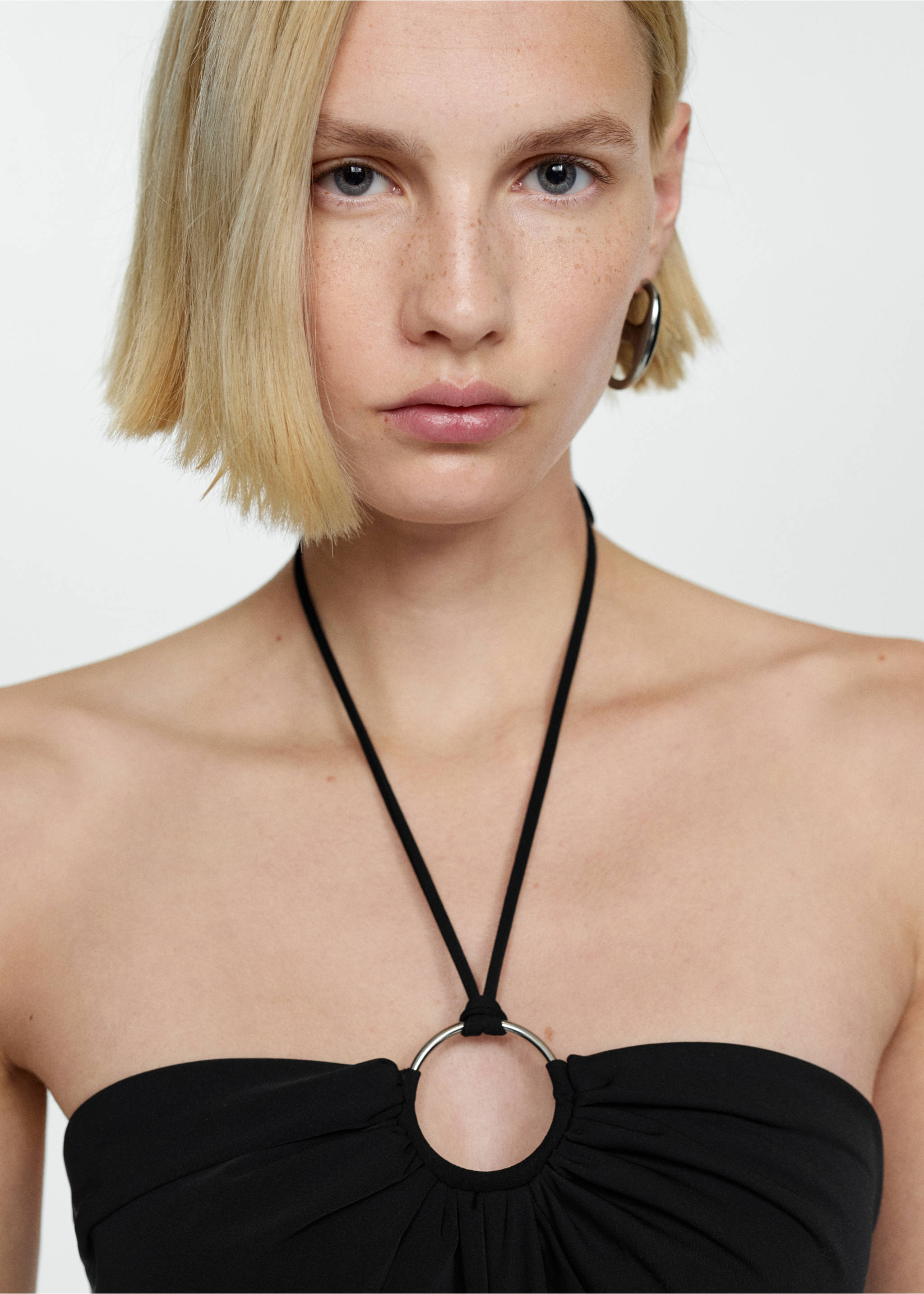 Halter-neck jumpsuit with ring - Details of the article 1, Black. Ref: 77020359-00.