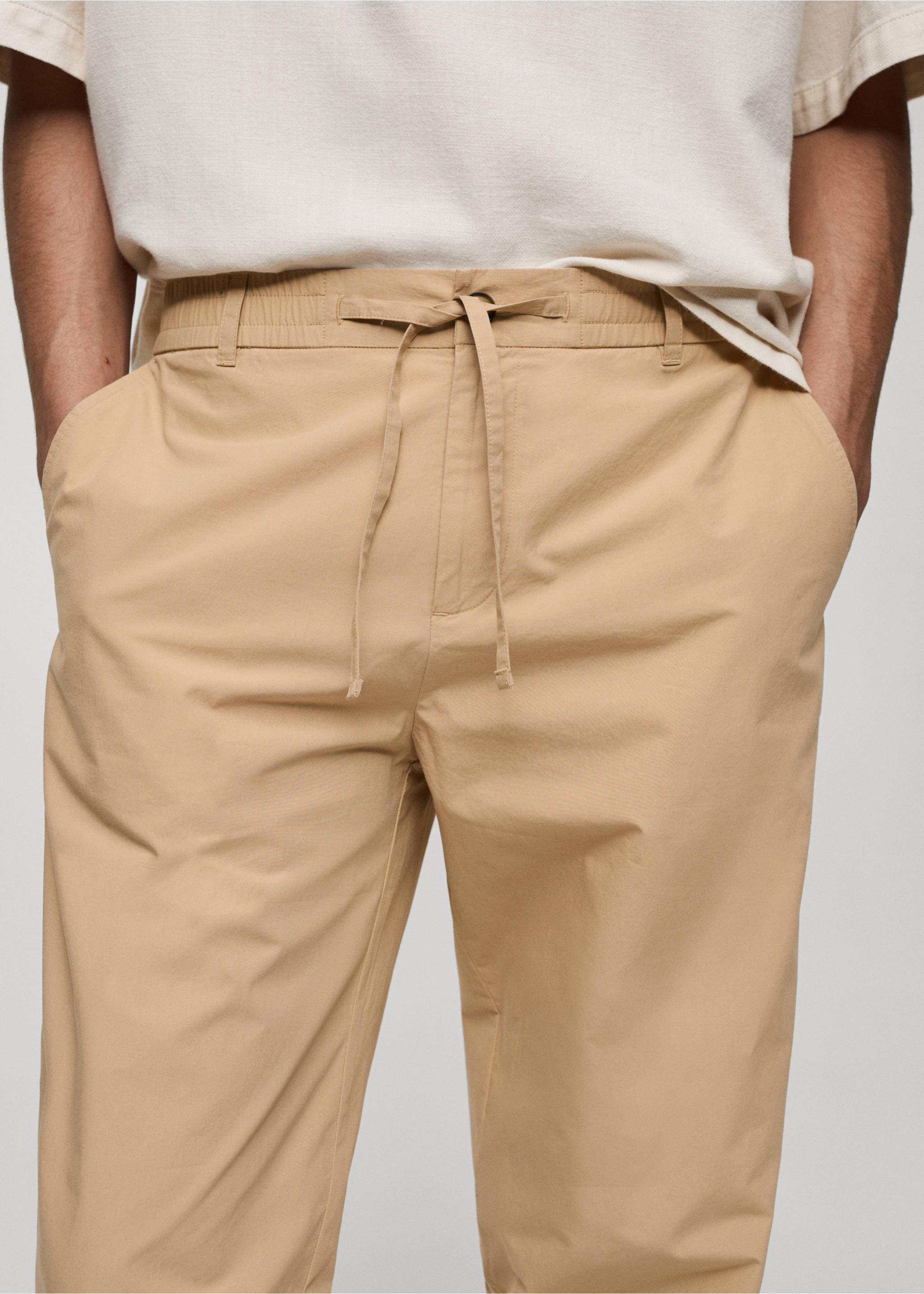 Drawstring cotton trousers - Details of the article 1, Beige. Ref: 77020568-00.