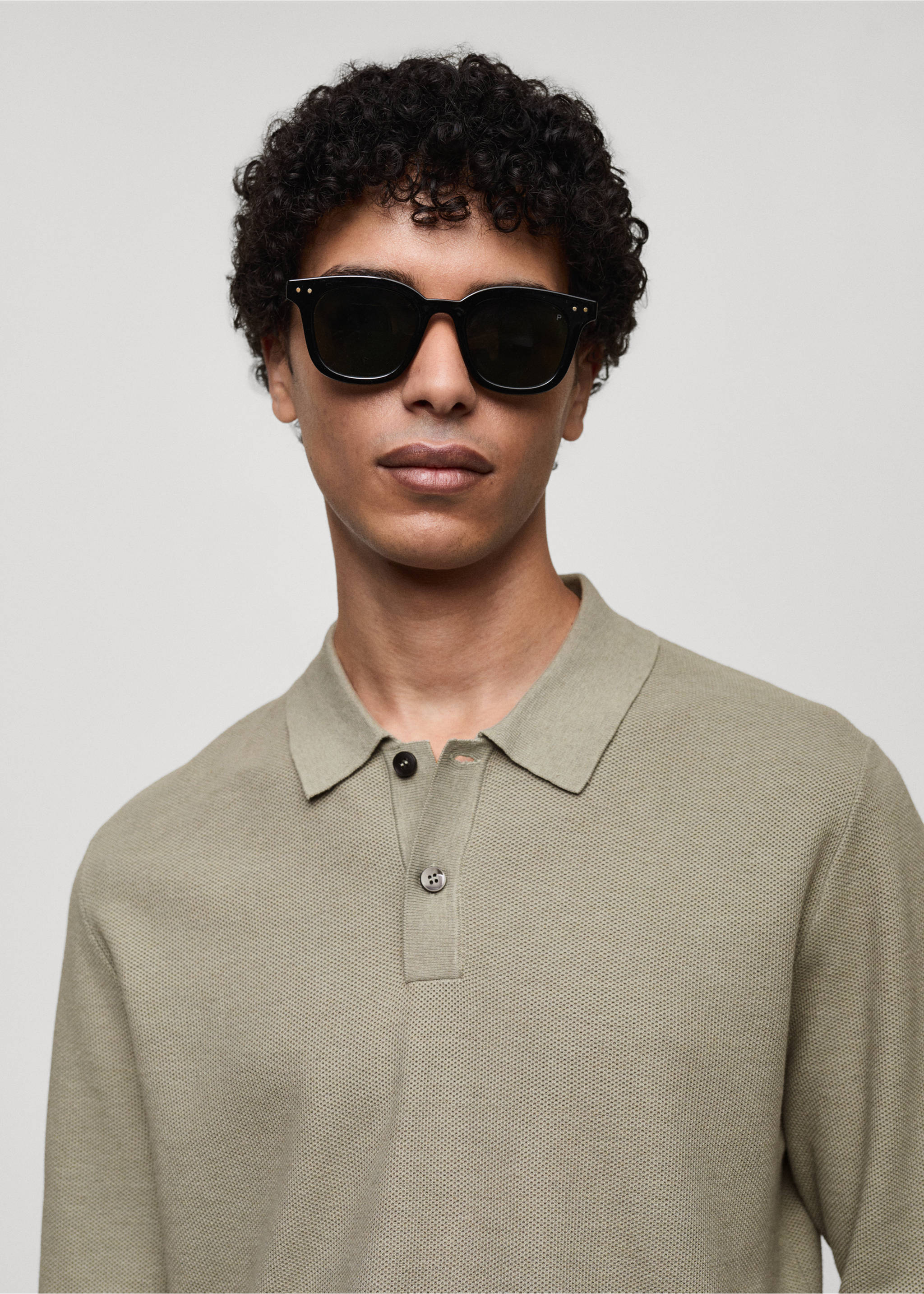 Knitted structured polo sweater - Details of the article 1, Pastel Green. Ref: 77024449-00.