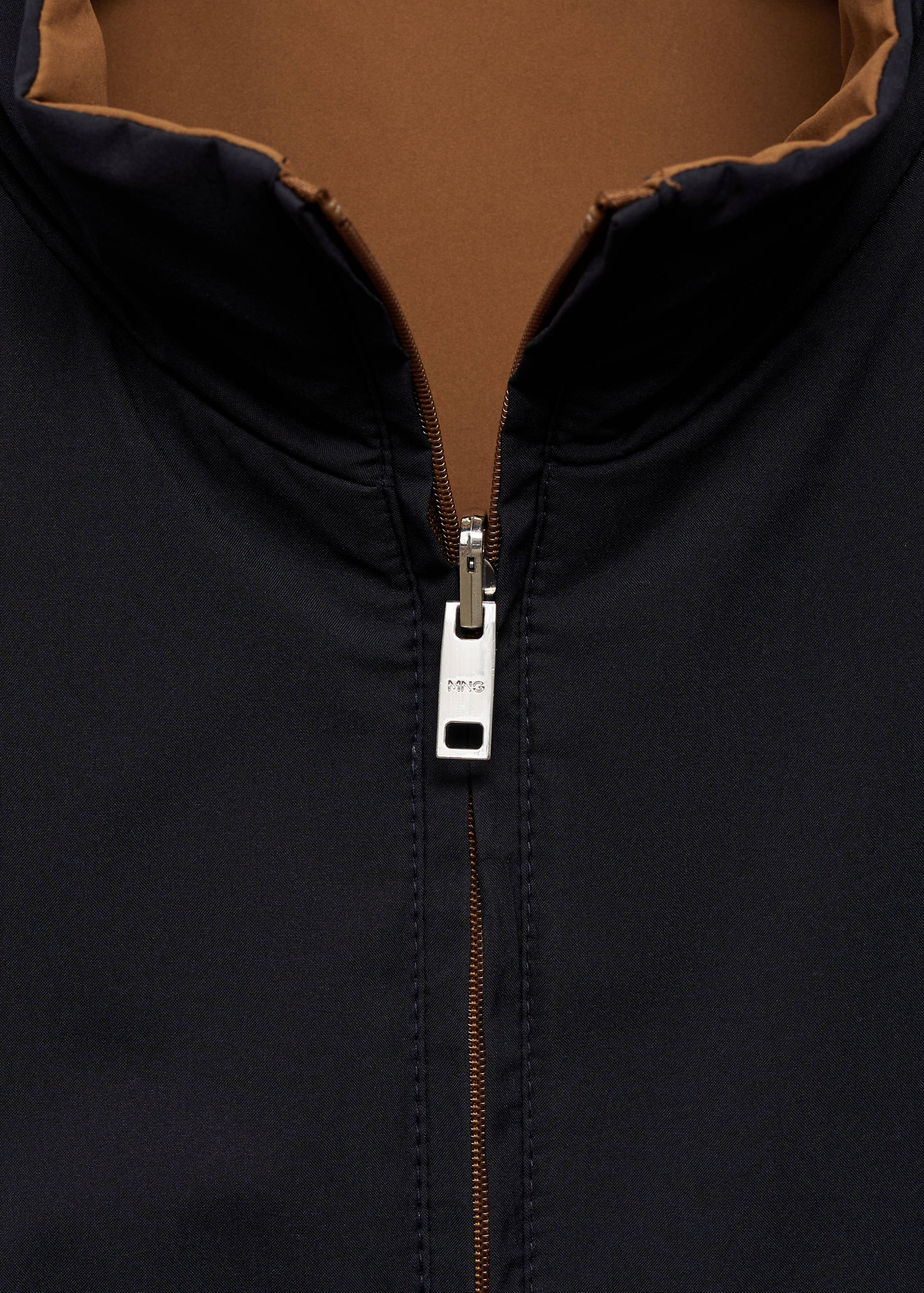 Waterafstotende reversibele bodywarmer - Detail van het artikel 8