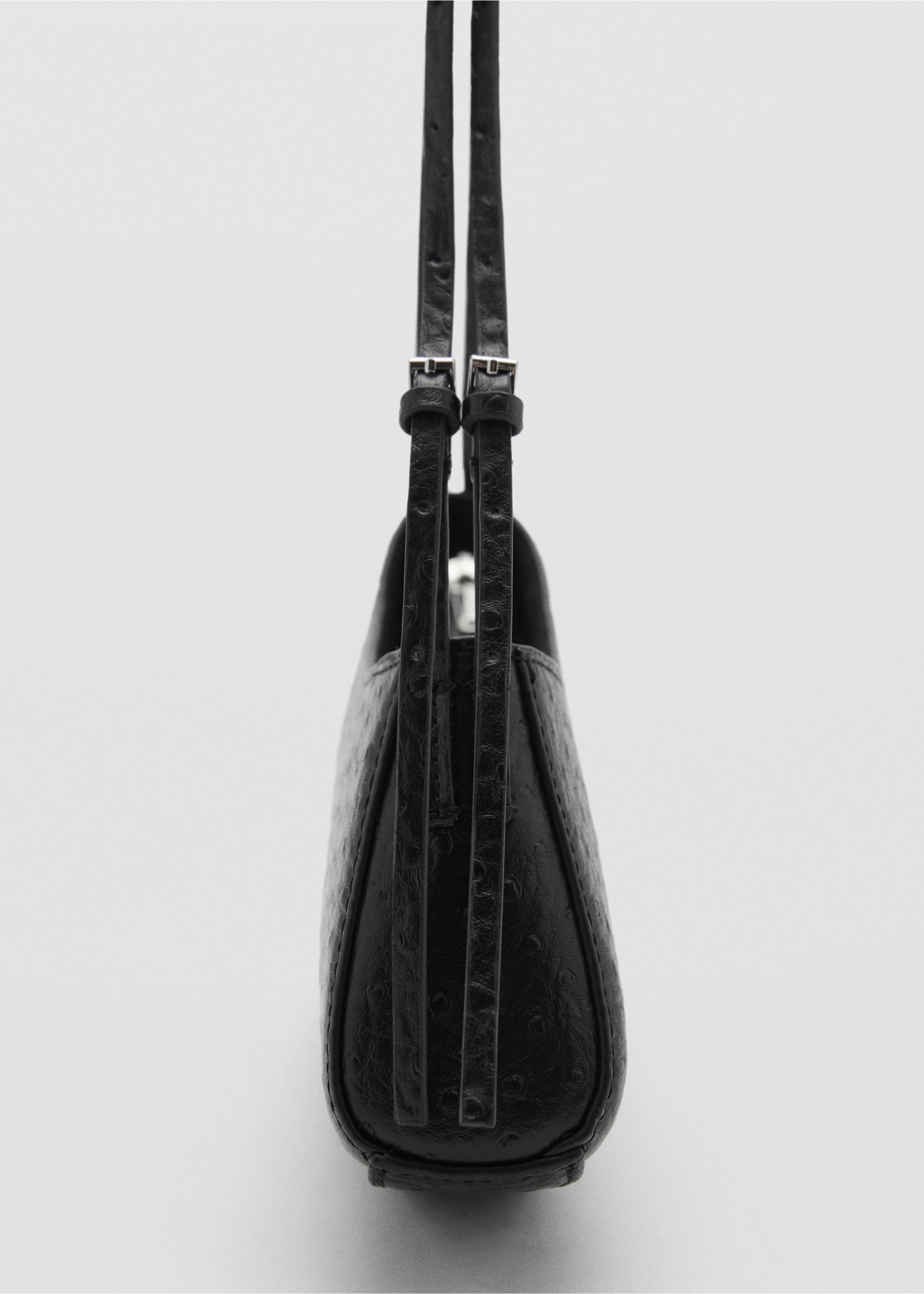 Oval textured bag - Details of the article 1, Black. Ref: 77047933-00.