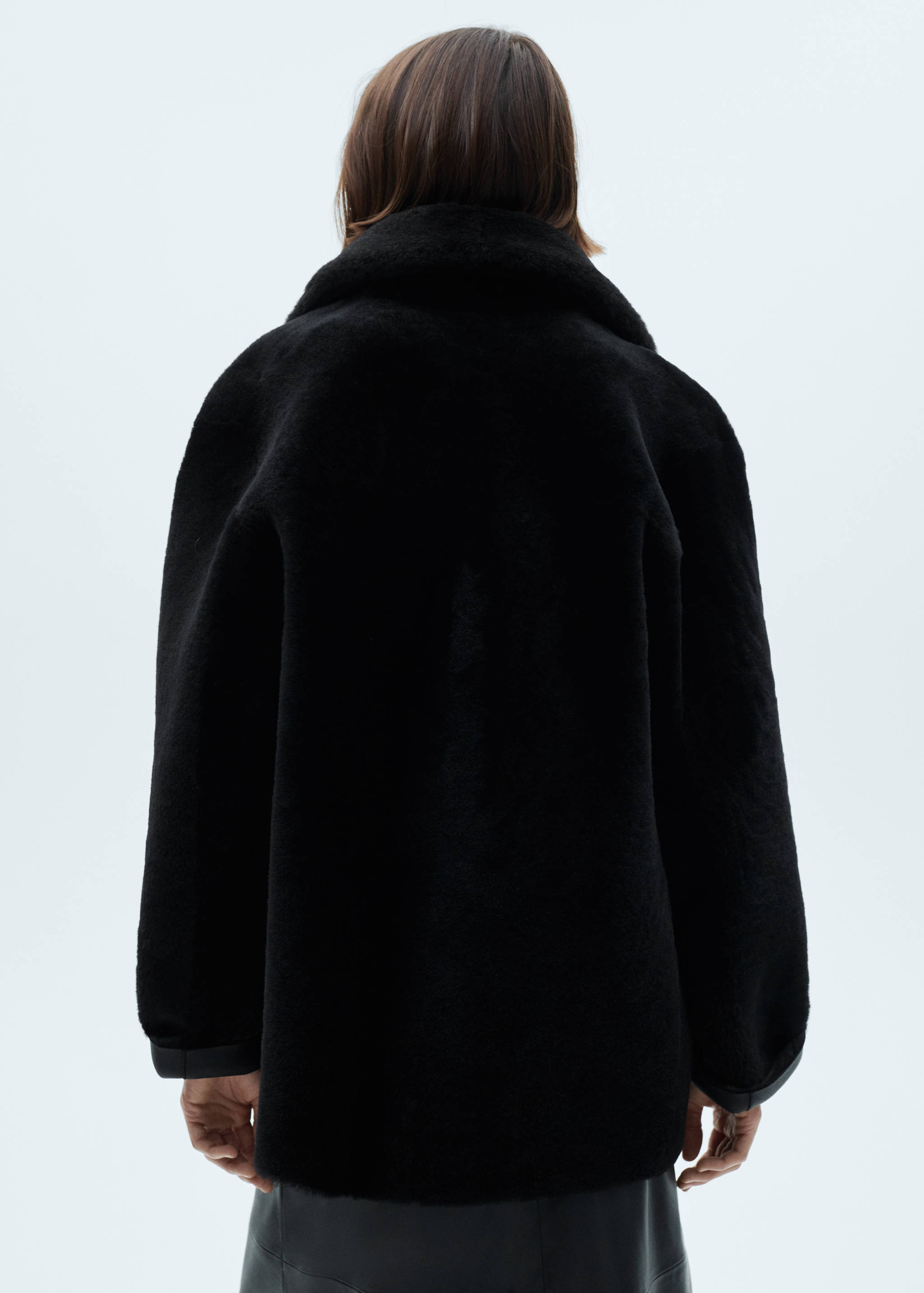 Double-breasted leather coat - Reverse of the article