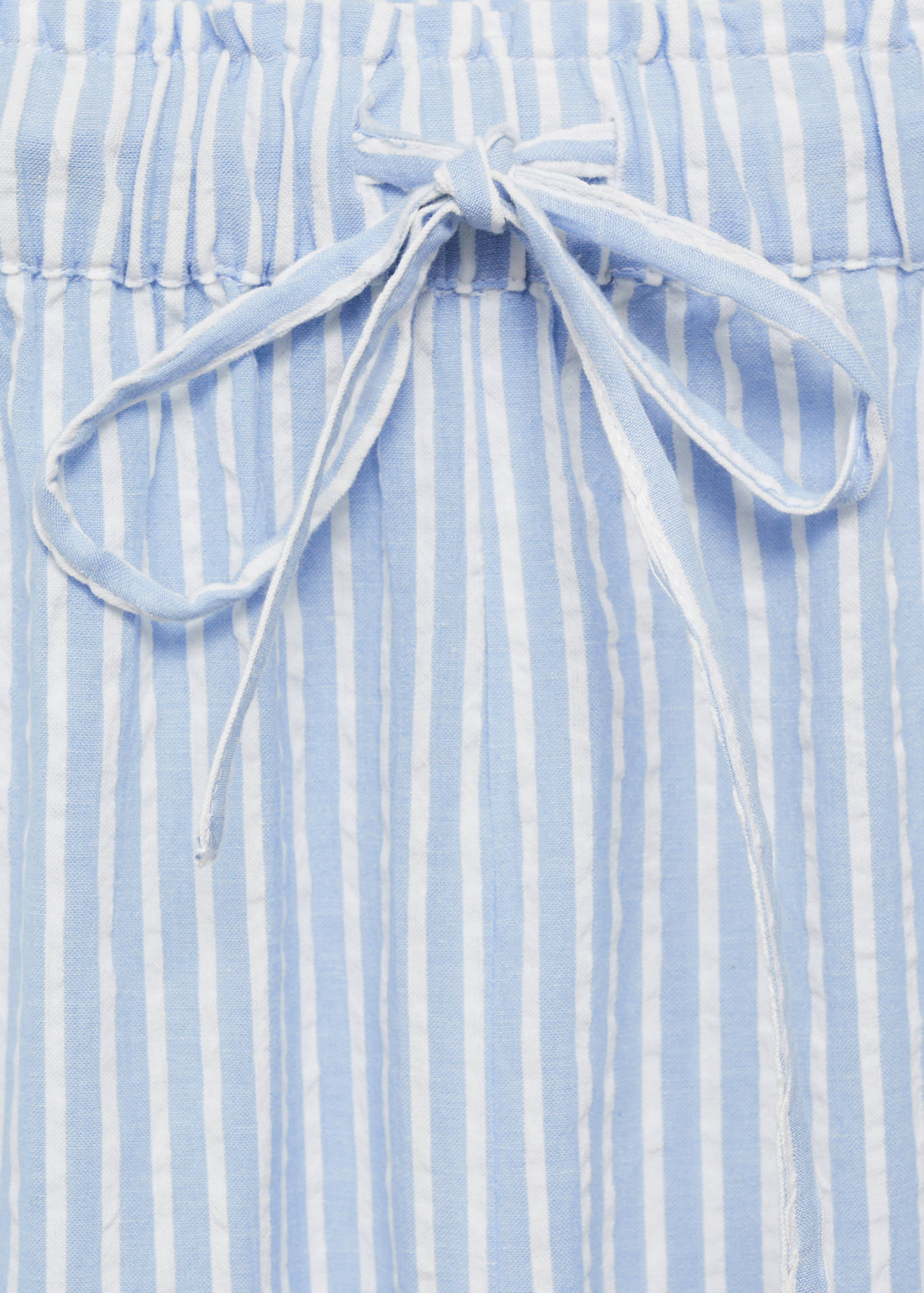 Calças às riscas bordadas - Pormenor do artigo 8