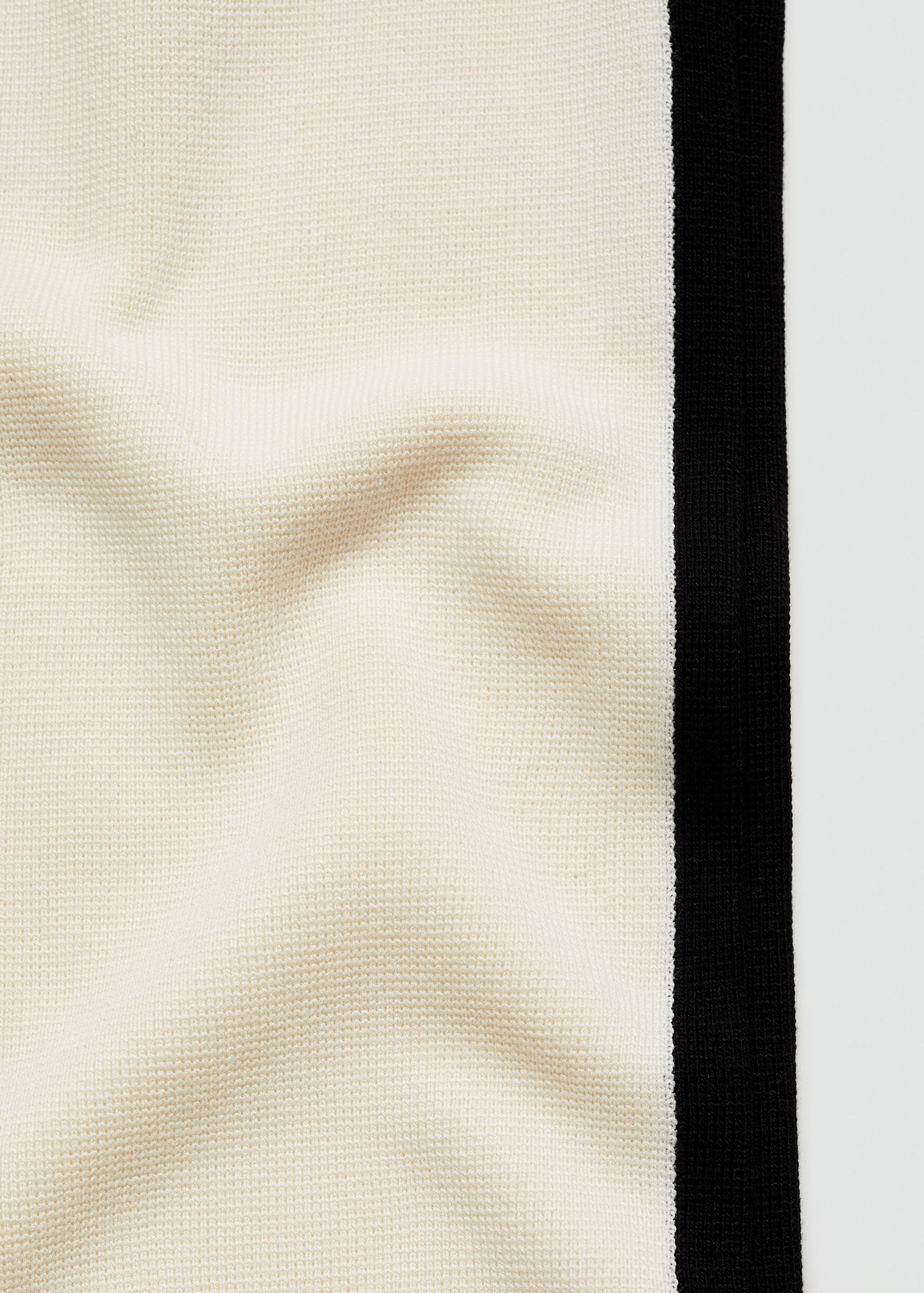 Striped knitted trousers with contrasting sides - Details of the article 0