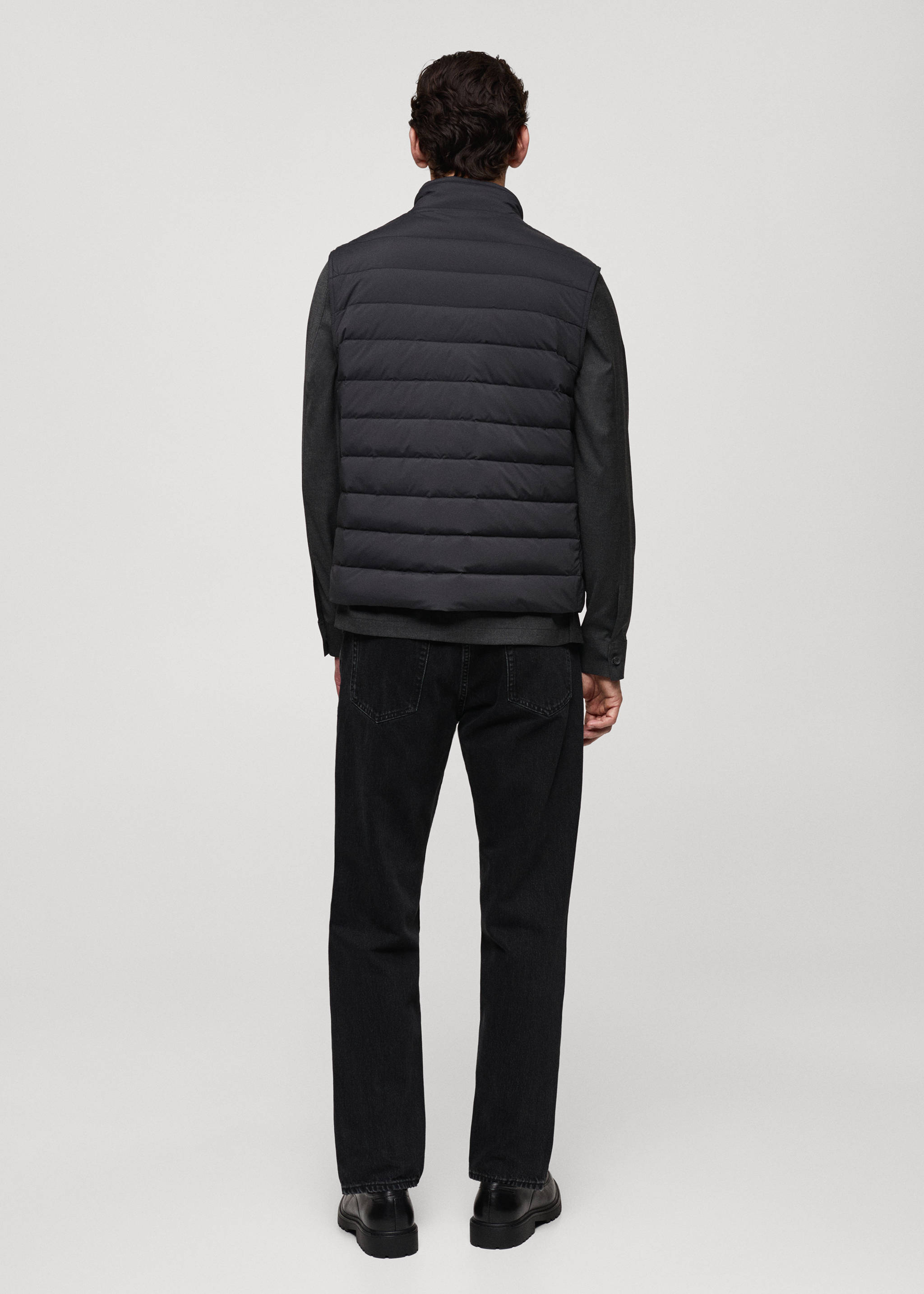 Täckväst fjäderstoppning - Artikelns baksida