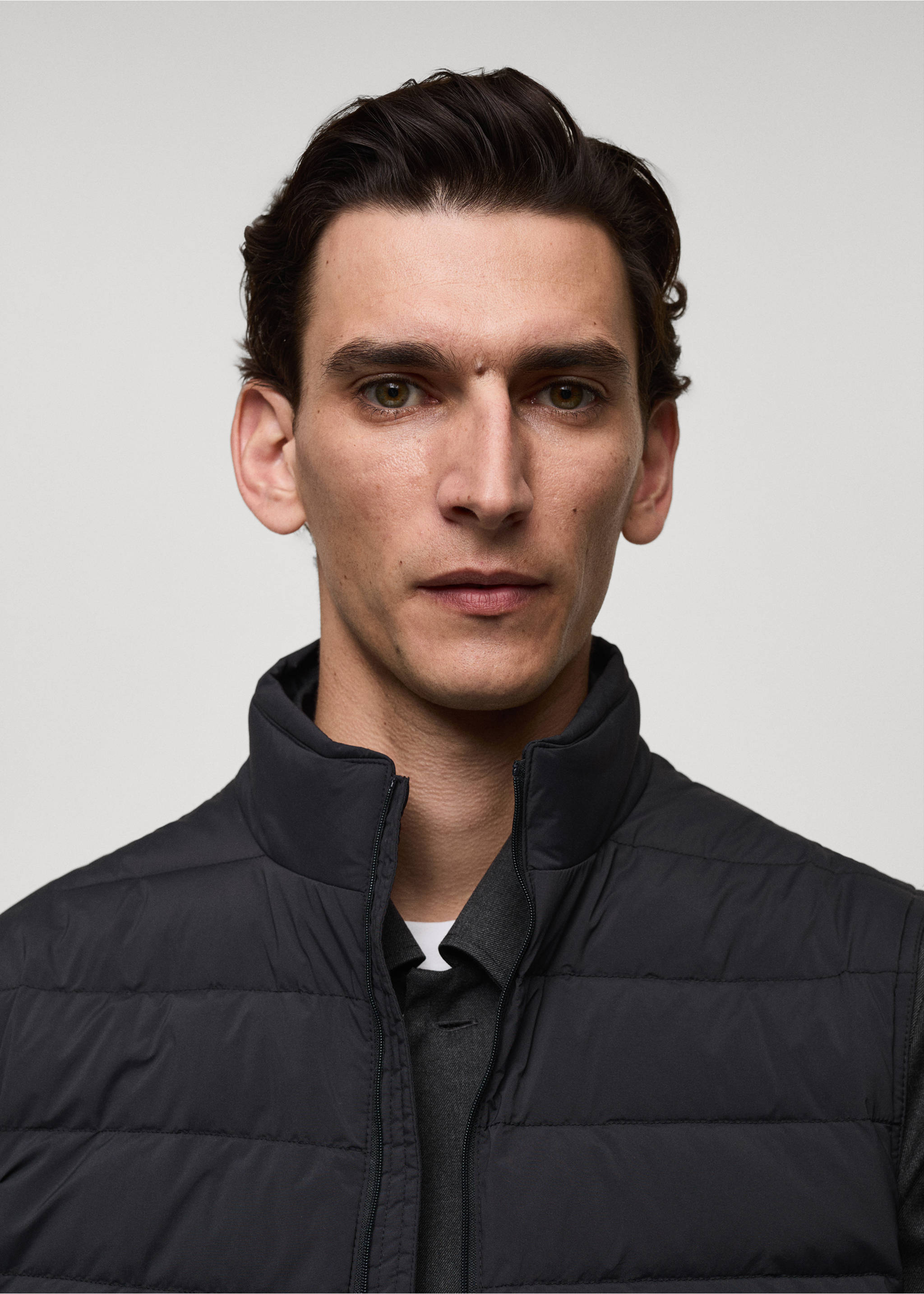 Quilted gilet with feather filling - Details of the article 1, Charcoal. Ref: 77054432-00.