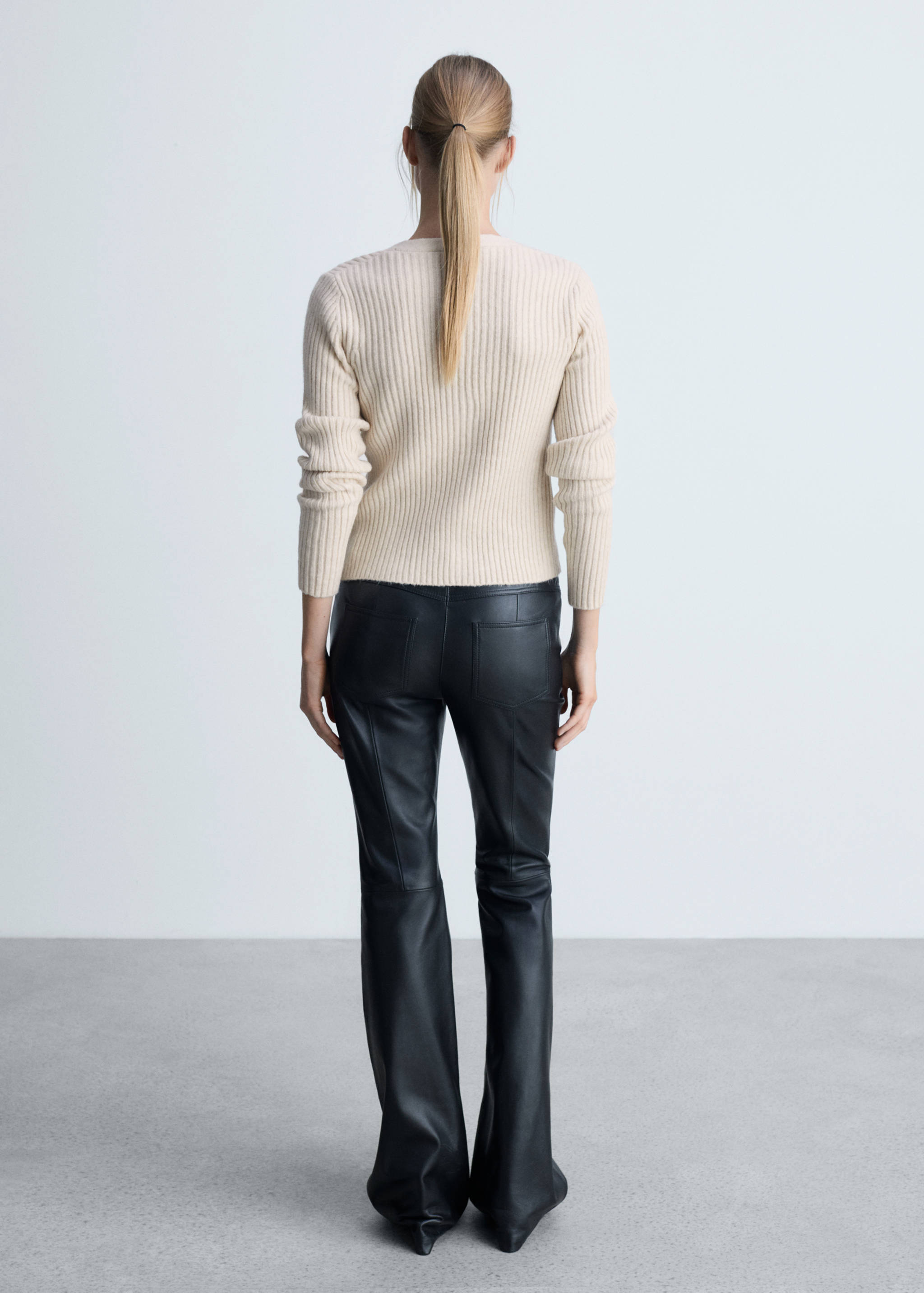 Knitted cardigan with metallic buttons - Reverse of the article