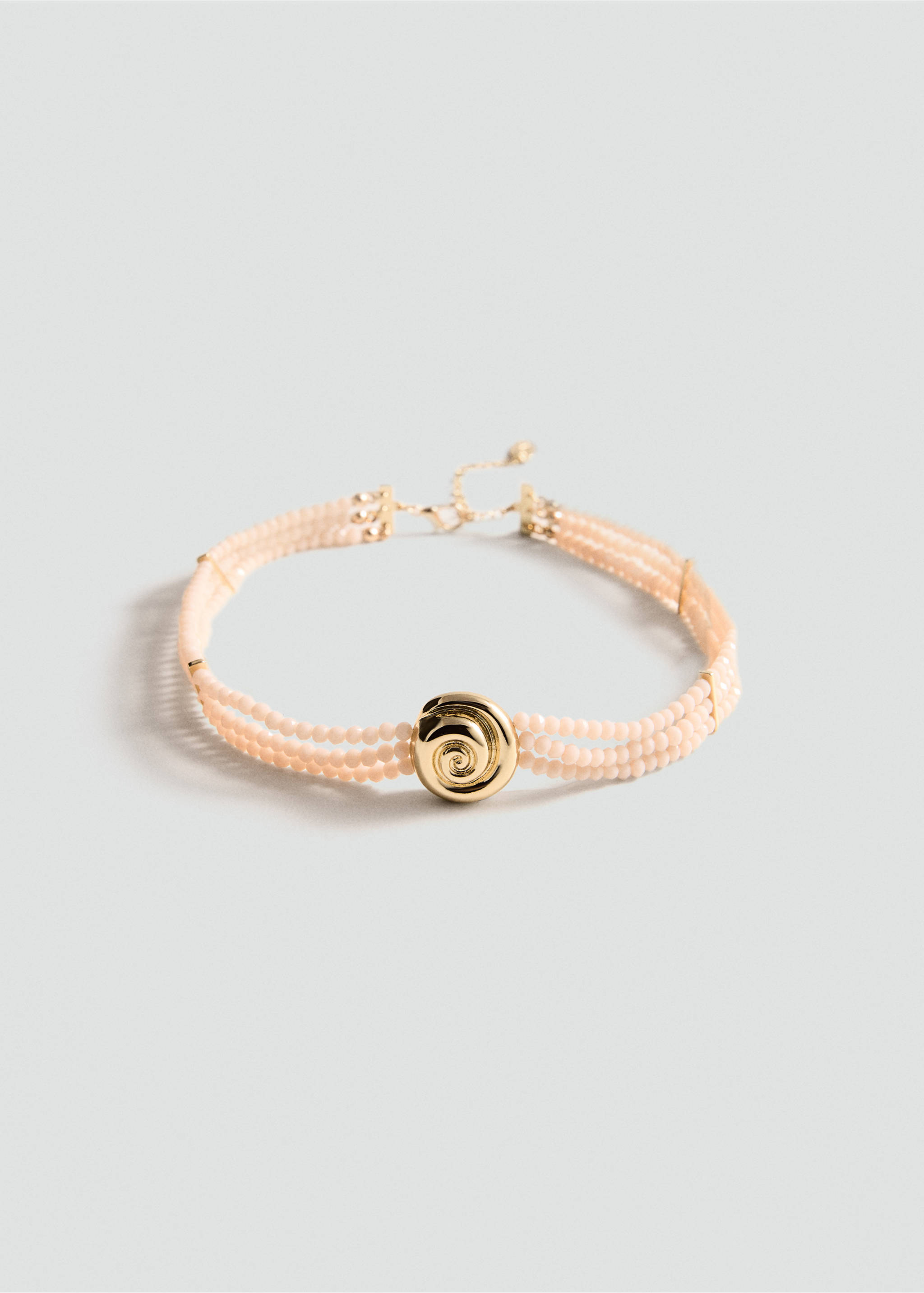 Pink multi-strand beaded collar necklace with a central polished gold-tone swirl pendant., Gold. Ref: 77060348-00.