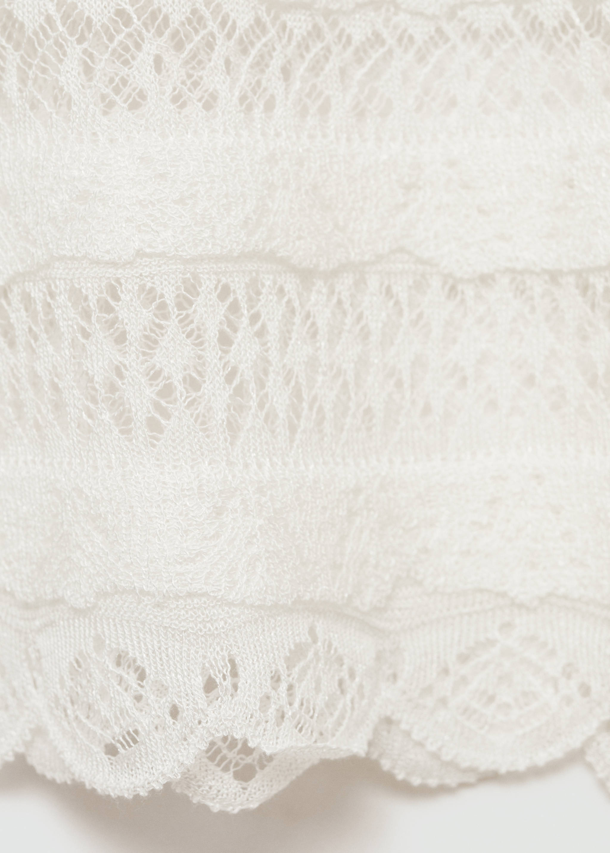 Top malha ponto aberto - Pormenor do artigo 8