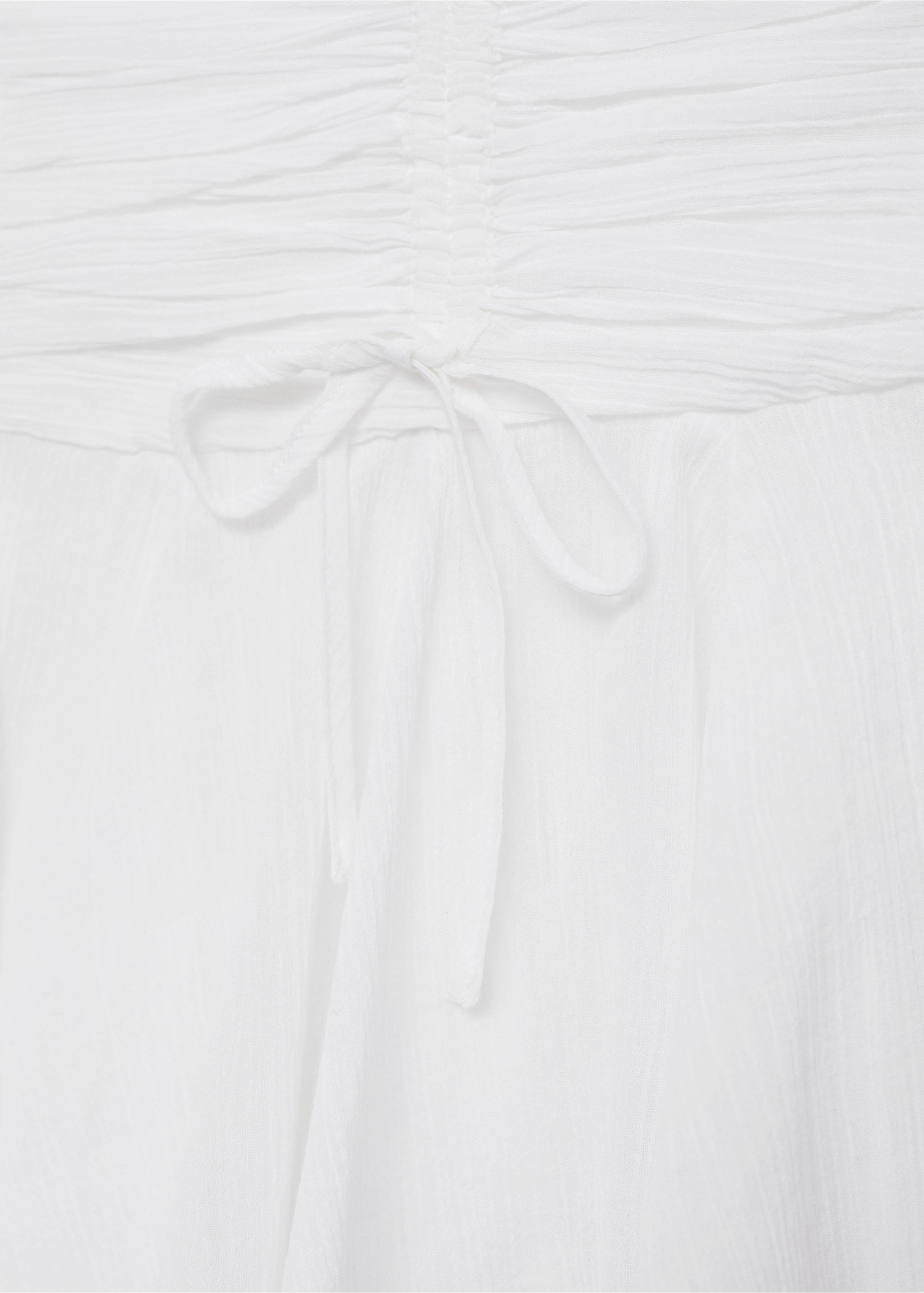 Asymmetrical mini-skirt with bows - Details of the article 8, White. Ref: 77071505-00.