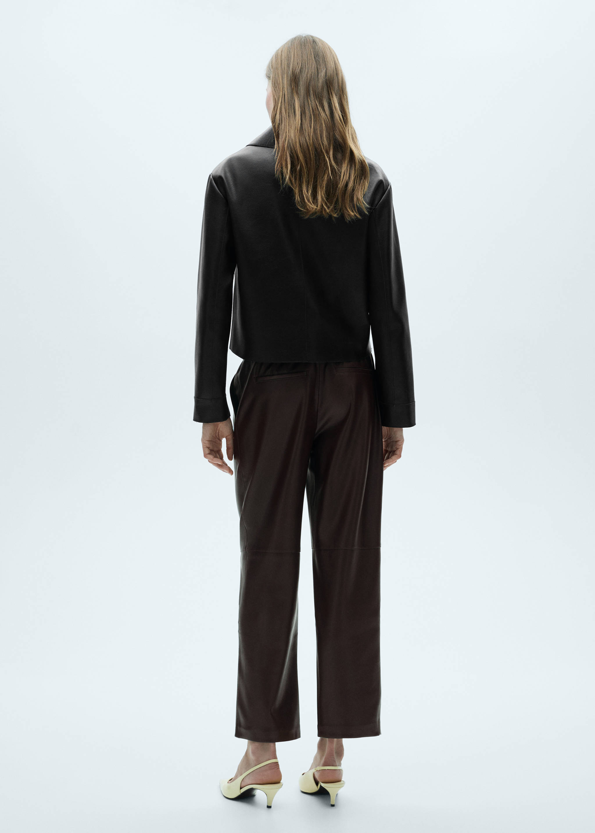 Faux-leather trousers with elastic waist - Reverse of the article