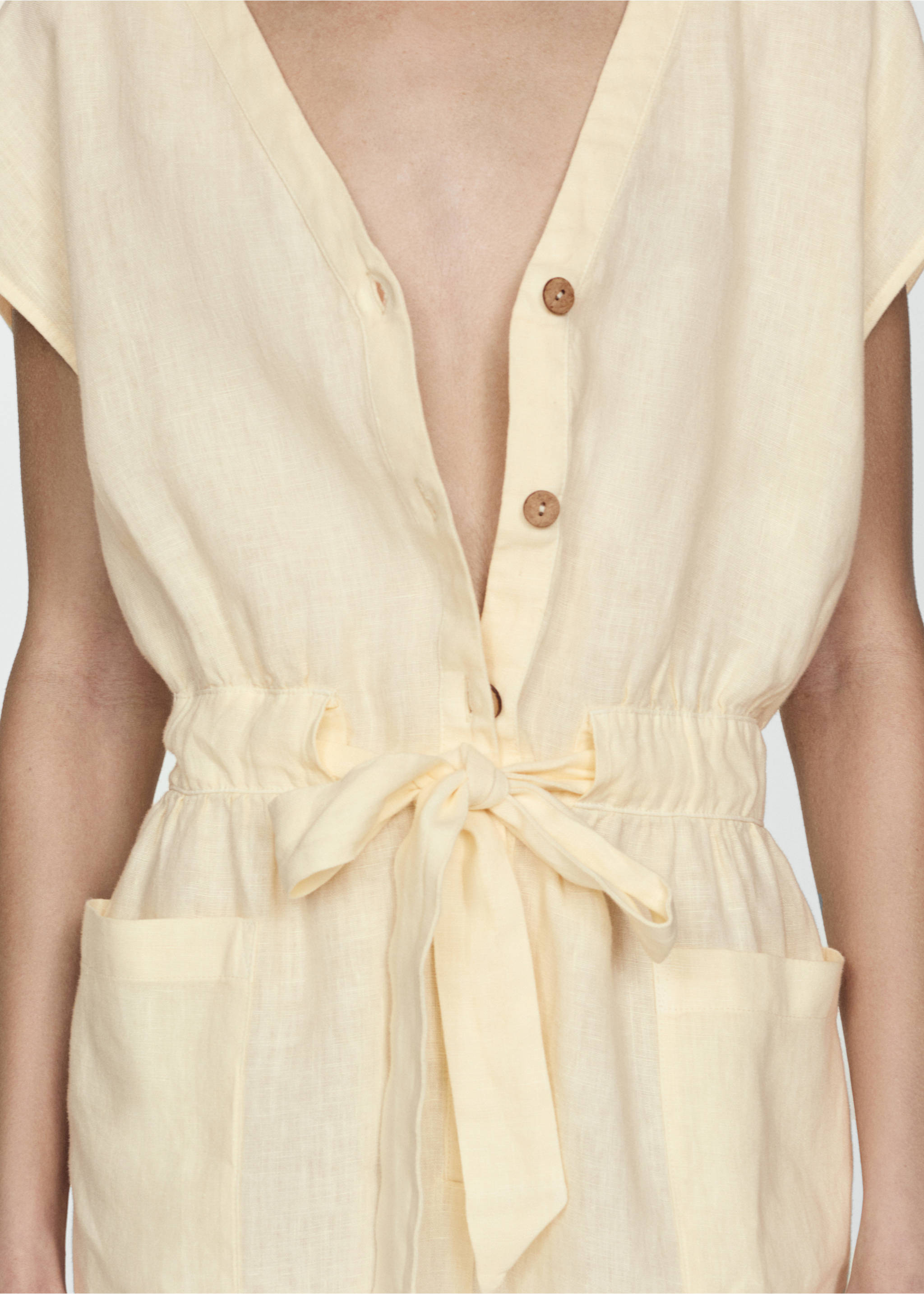 Short linen jumpsuit with bow - Details of the article 3, Pastel Yellow. Ref: 77080352-00.