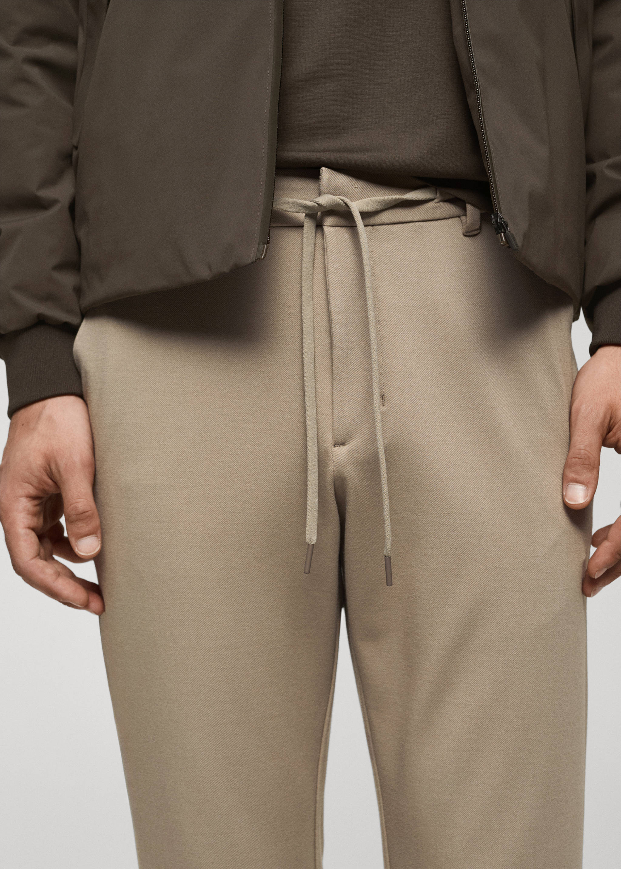 Stretch fabric slim-fit trousers with drawstring - Details of the article 1