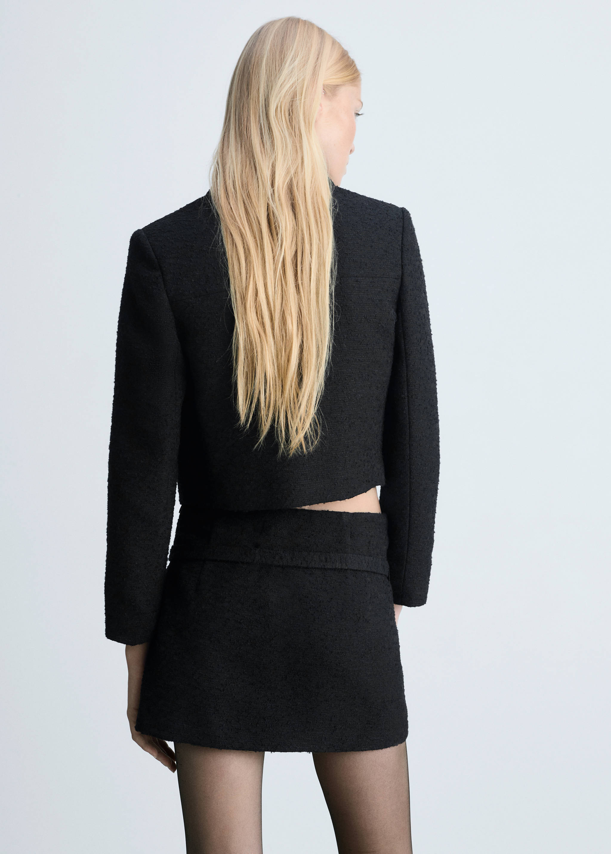 Tweed mini-skirt with decorative belt - Reverse of the article