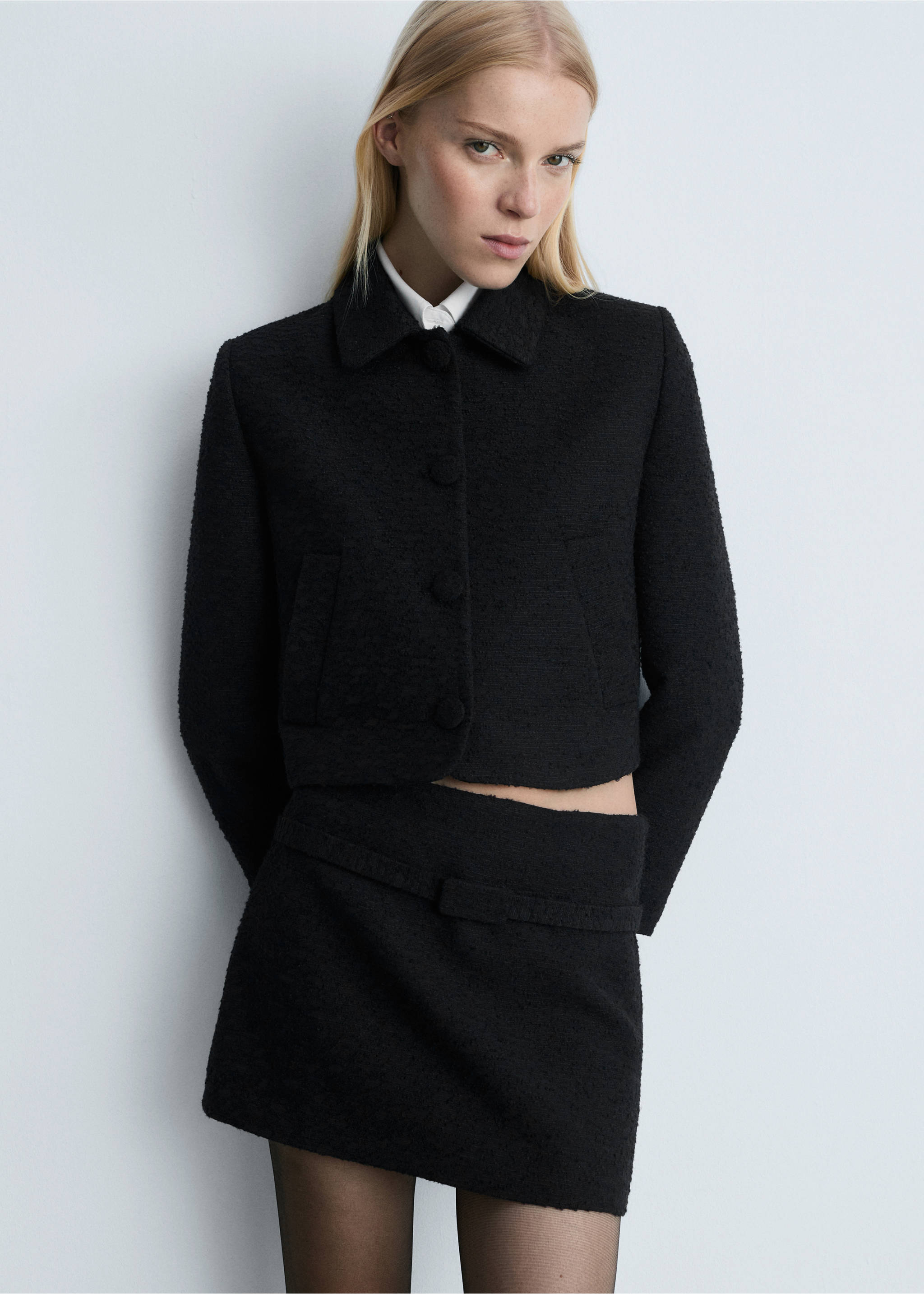 Tweed mini-skirt with decorative belt - Details of the article 1, Black. Ref: 77086759-00.