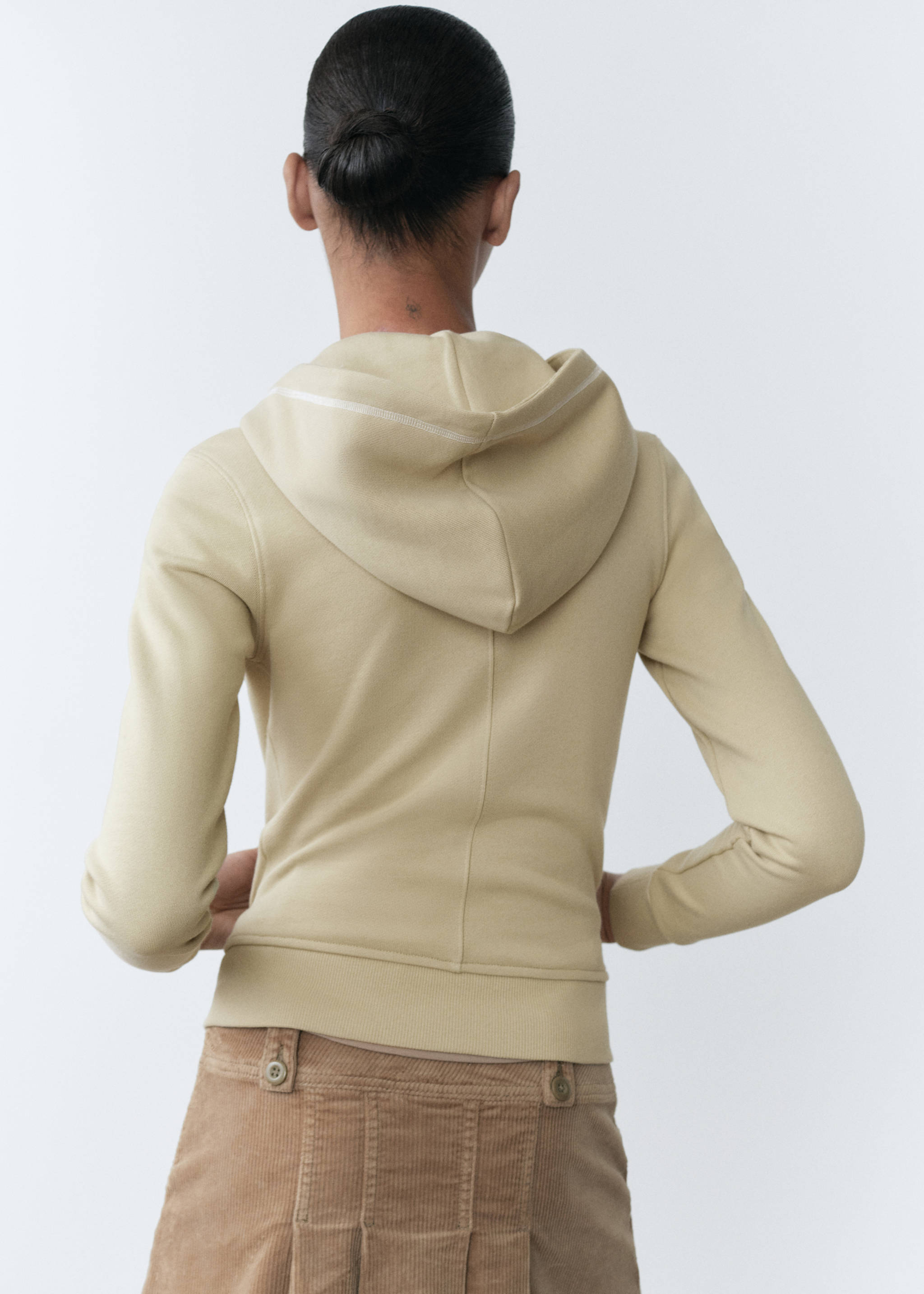 Dessuadora cotó missatge brodat - Revers de l'article