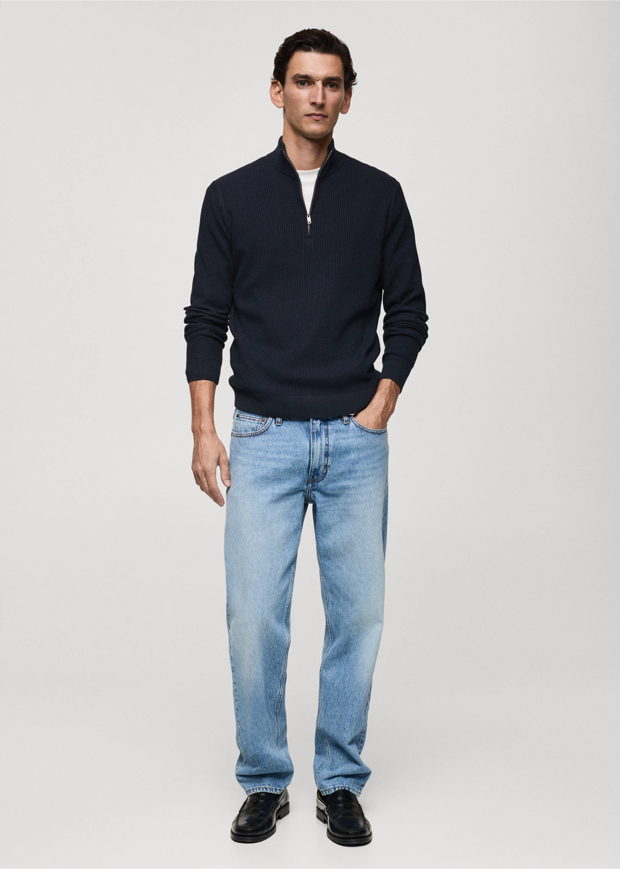 Navy blue ribbed knit jersey with a zip-collar worn with light blue jeans, Dark Navy. Ref: 87000611-00.