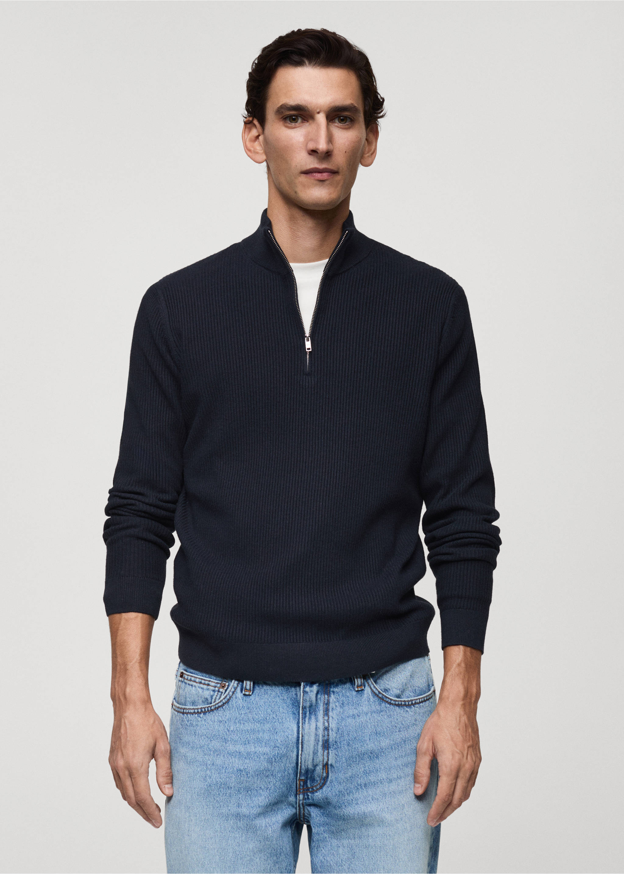Navy blue ribbed knit jersey with a high half-zip collar worn with light blue jeans., Dark Navy. Ref: 87000611-00.