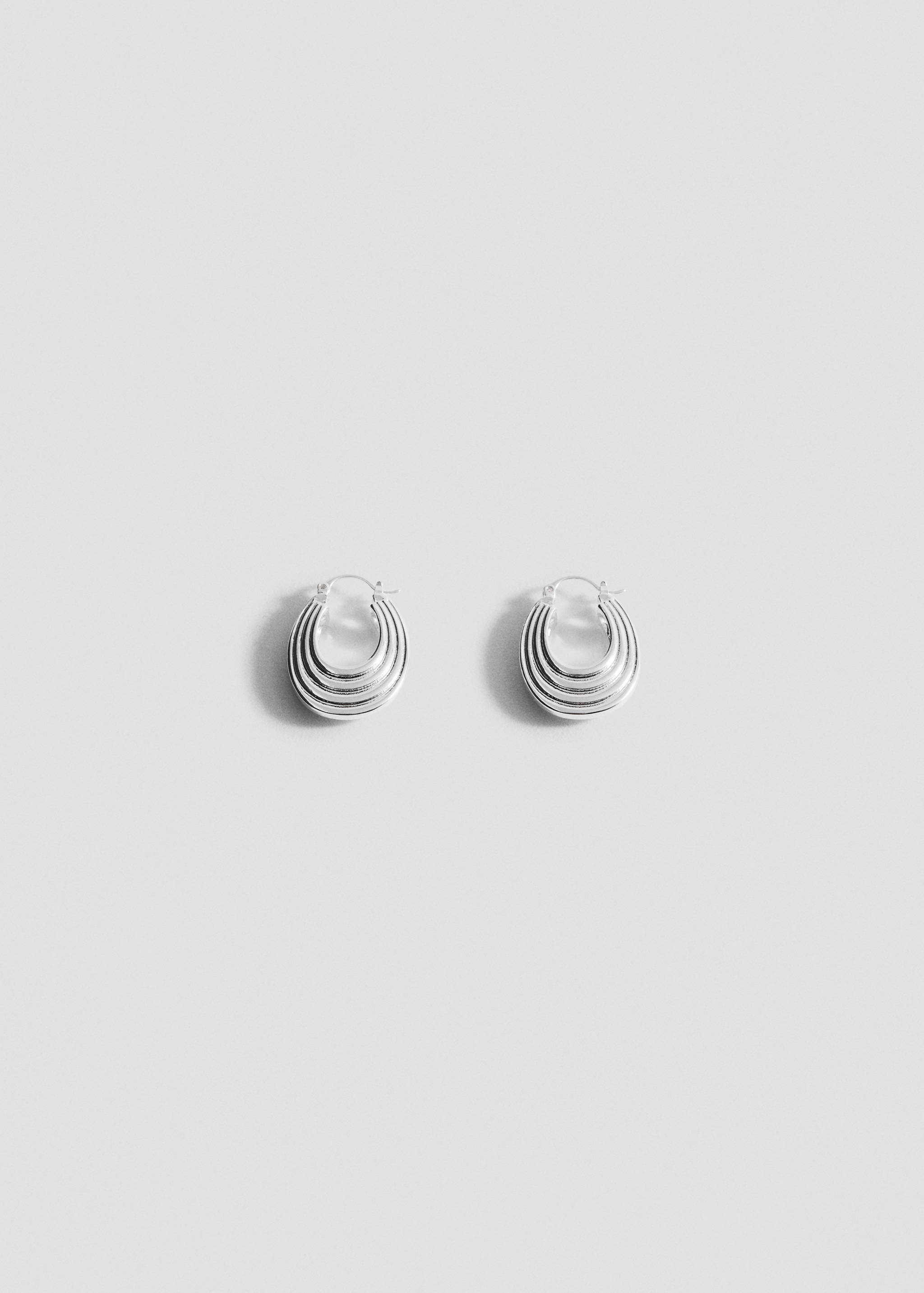 Silver-toned multi-layered ribbed hoop earrings.