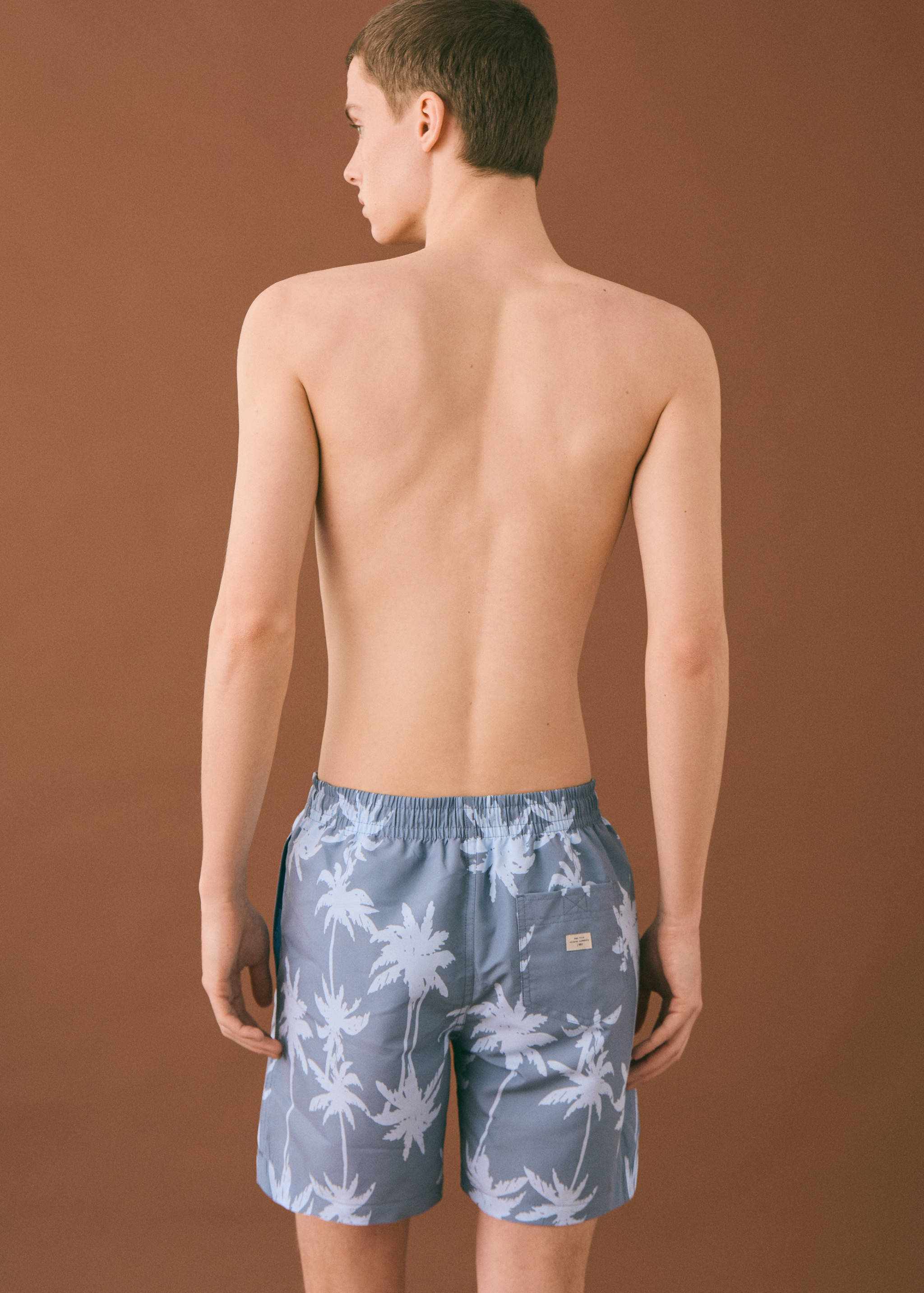 Palm trees print swimsuit trunks - Reverse of the article